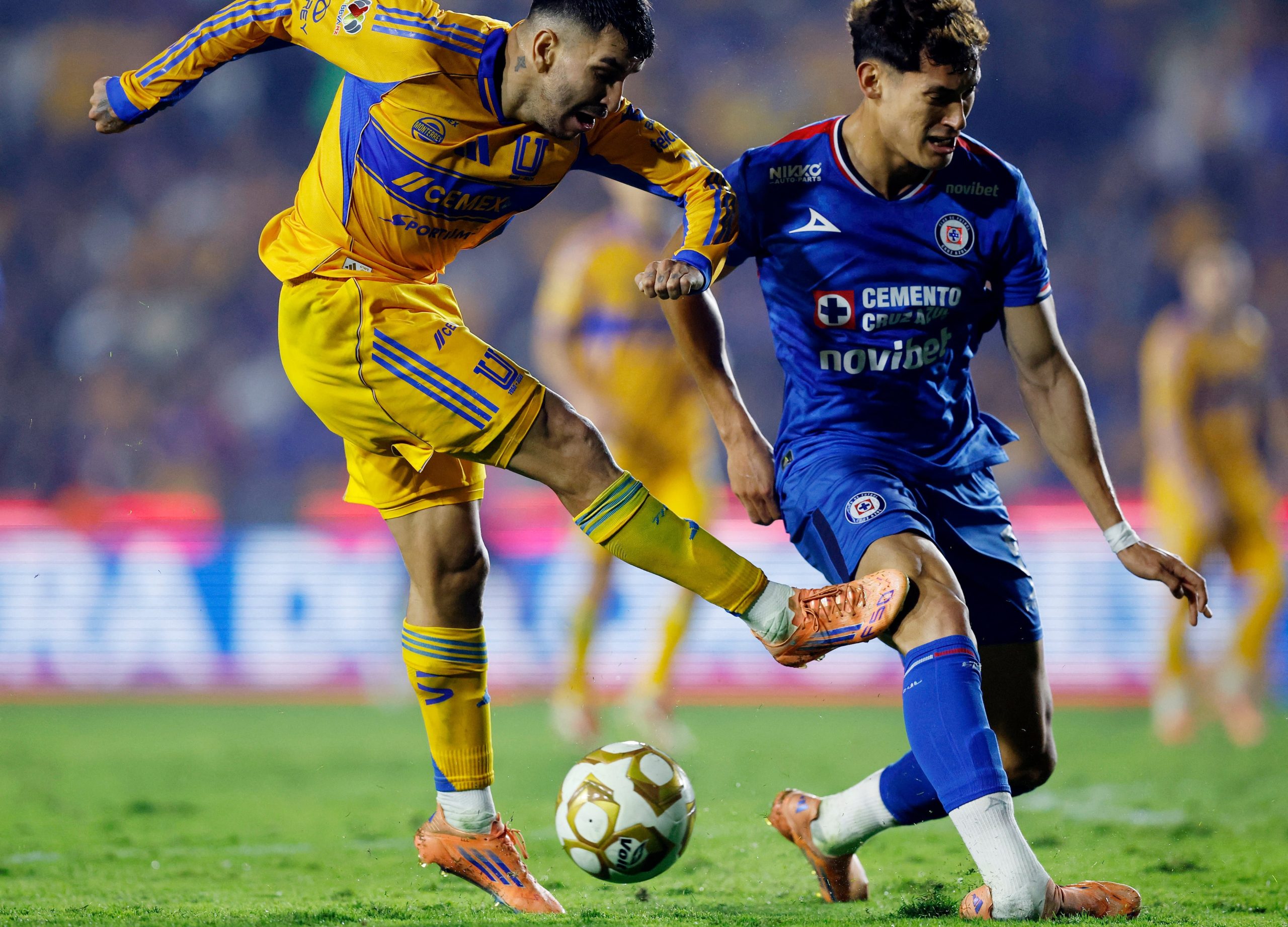 Soccer Football - Liga MX - Semi Final - Second Leg - Tigres UANL v Cruz Azul - Estadio Universitario, Monterrey, Mexico - December 6, 2025 Cruz Azul's Jesus Orozco gets fouled by Tigres UANL's Angel Correa REUTERS/Daniel Becerril