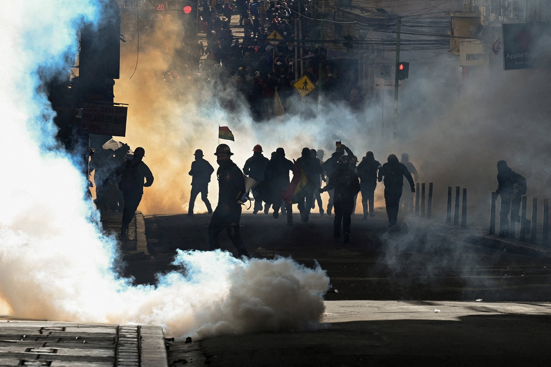 Miners affiliated with the Central Obrera Boliviana (COB) clash with riot police after taking part in the