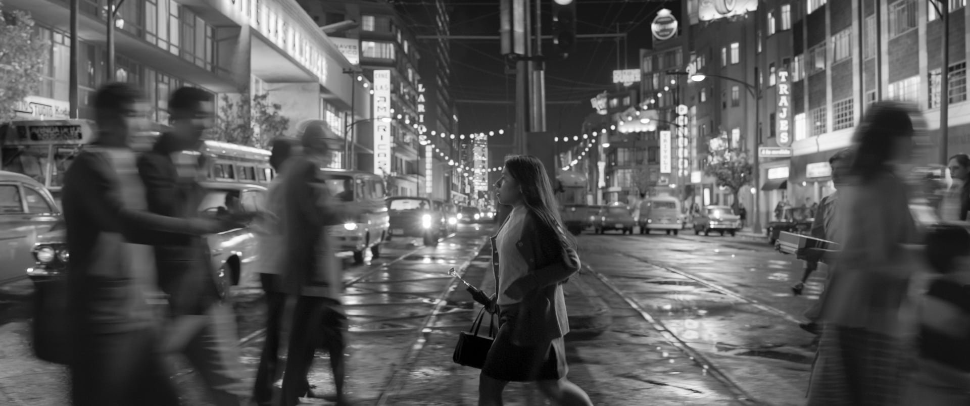 In an undated image provided by Netflix, Yalitza Aparicio crosses the intersection of Baja California and Insurgentes avenues in Alfonso Cuarón’s “Roma.” Distributed by Netflix, “Roma” seems to be prompting a crisis of conscience among Oscars voters. (Alfonso Cuaron/Netflix via The New York Times) -- NO SALES; FOR EDITORIAL USE ONLY WITH NYT STORY OSCARS VOTERS BY BROOKS BARNES FOR FEB. 15, 2019. ALL OTHER USE PROHIBITED. --