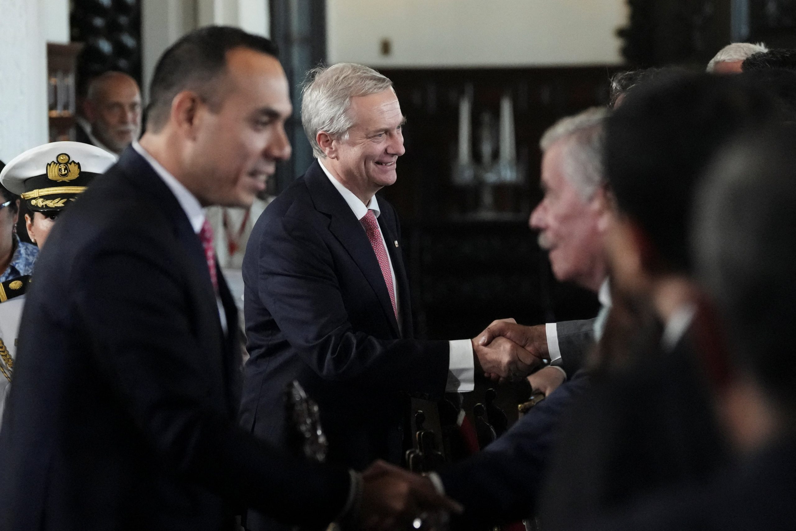 Peru's President Jose Jeri and Chile's President-elect Jose Antonio Kast greet people as they attend a meeting to address plans for a possible corridor to facilitate the return of Venezuelan migrants from Chile and Peru, according to Jeri, in Lima, Peru, January 7, 2026. REUTERS/Angela Ponce
