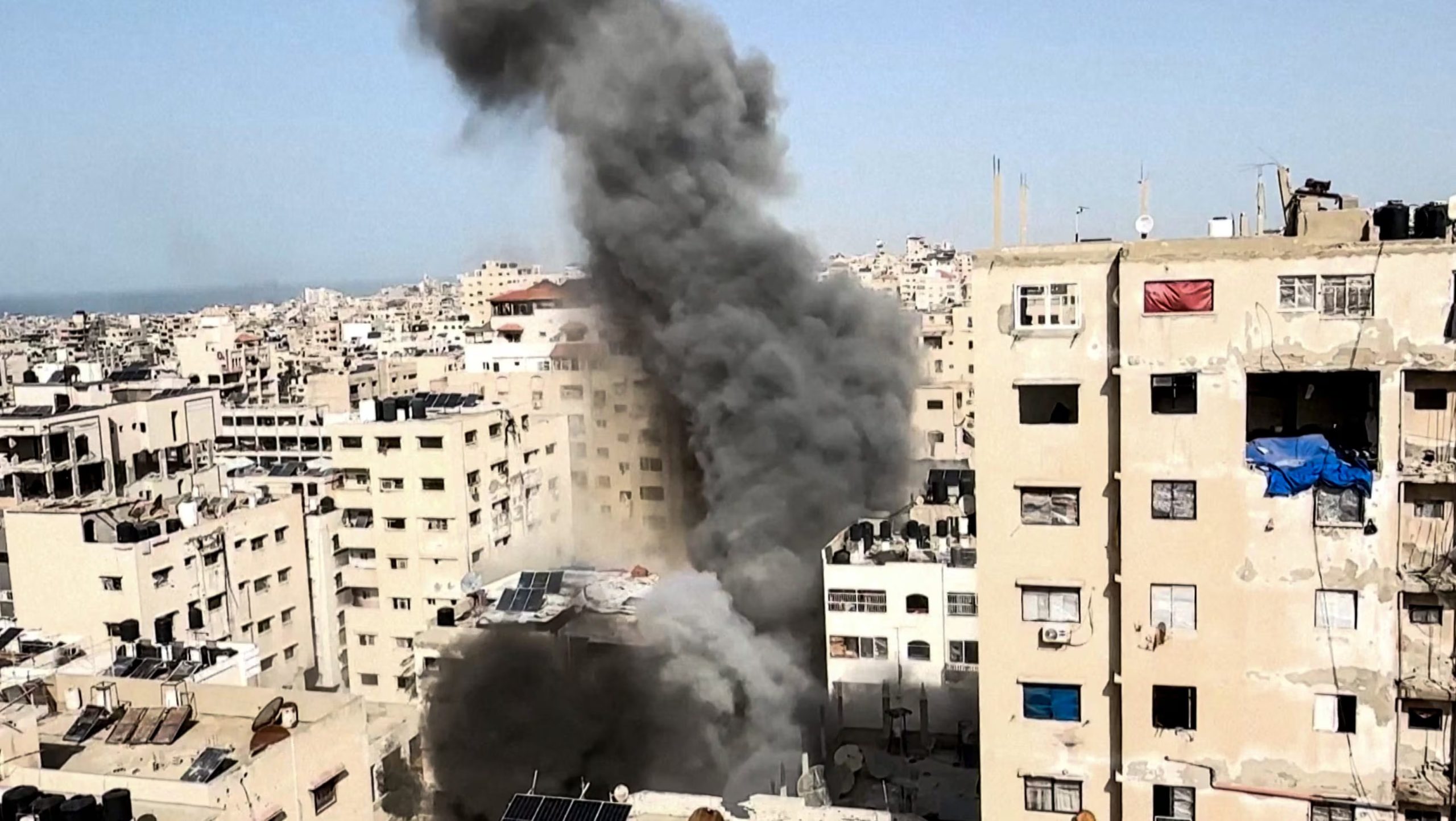 Smoke rises after a projectile fell on a building during an Israeli airstrike on Saturday, in Gaza City, January 31, 2026, in this screengrab from a video obtained by Reuters. VIDEO OBTAINED BY REUTERS via REUTERS