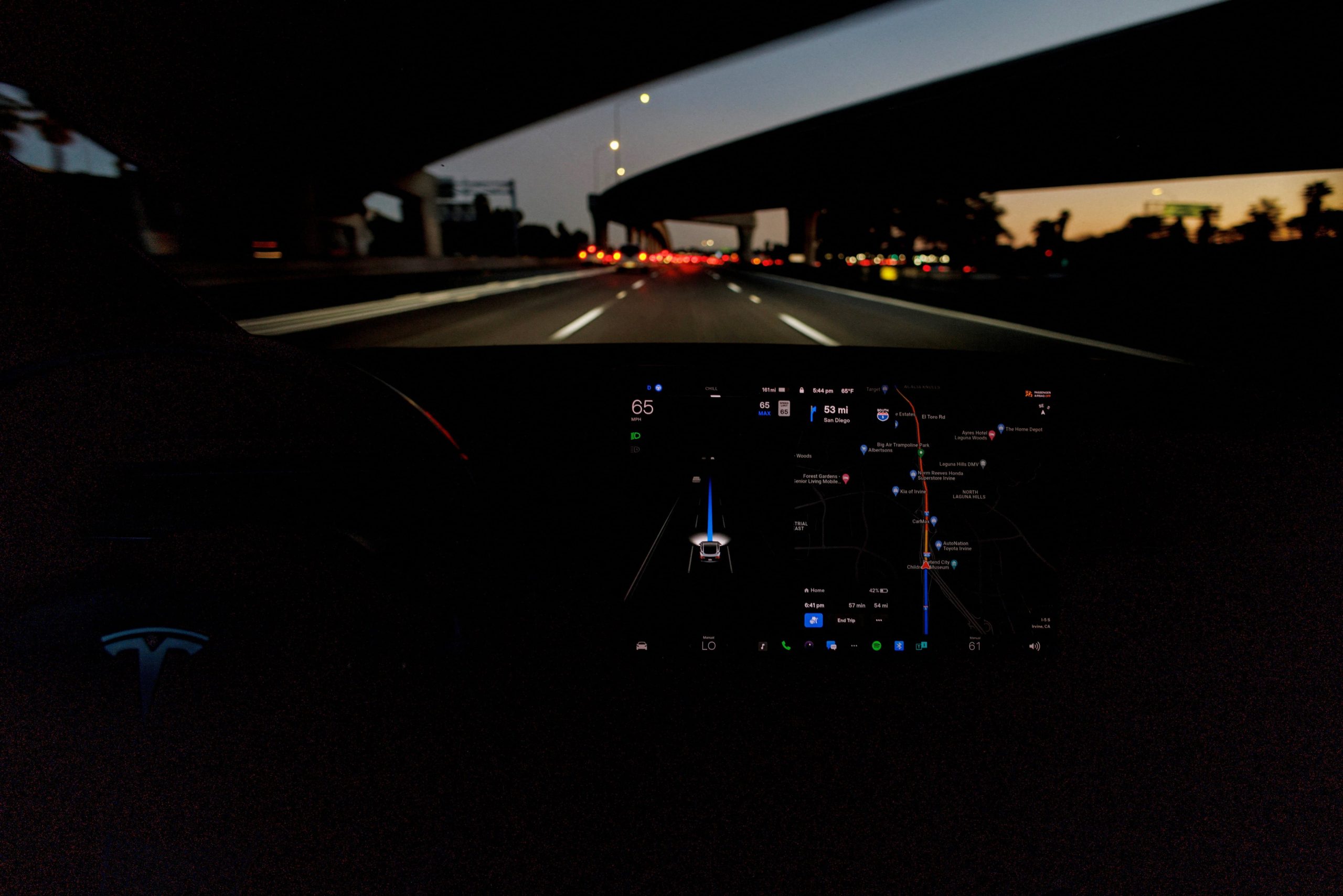 FILE PHOTO: A Tesla Model 3 vehicle is shown driving using Full Self Driving (FSD) beta software on a California highway near Irvine, California, U.S., February 7, 2023. REUTERS/Mike Blake/File Photo
