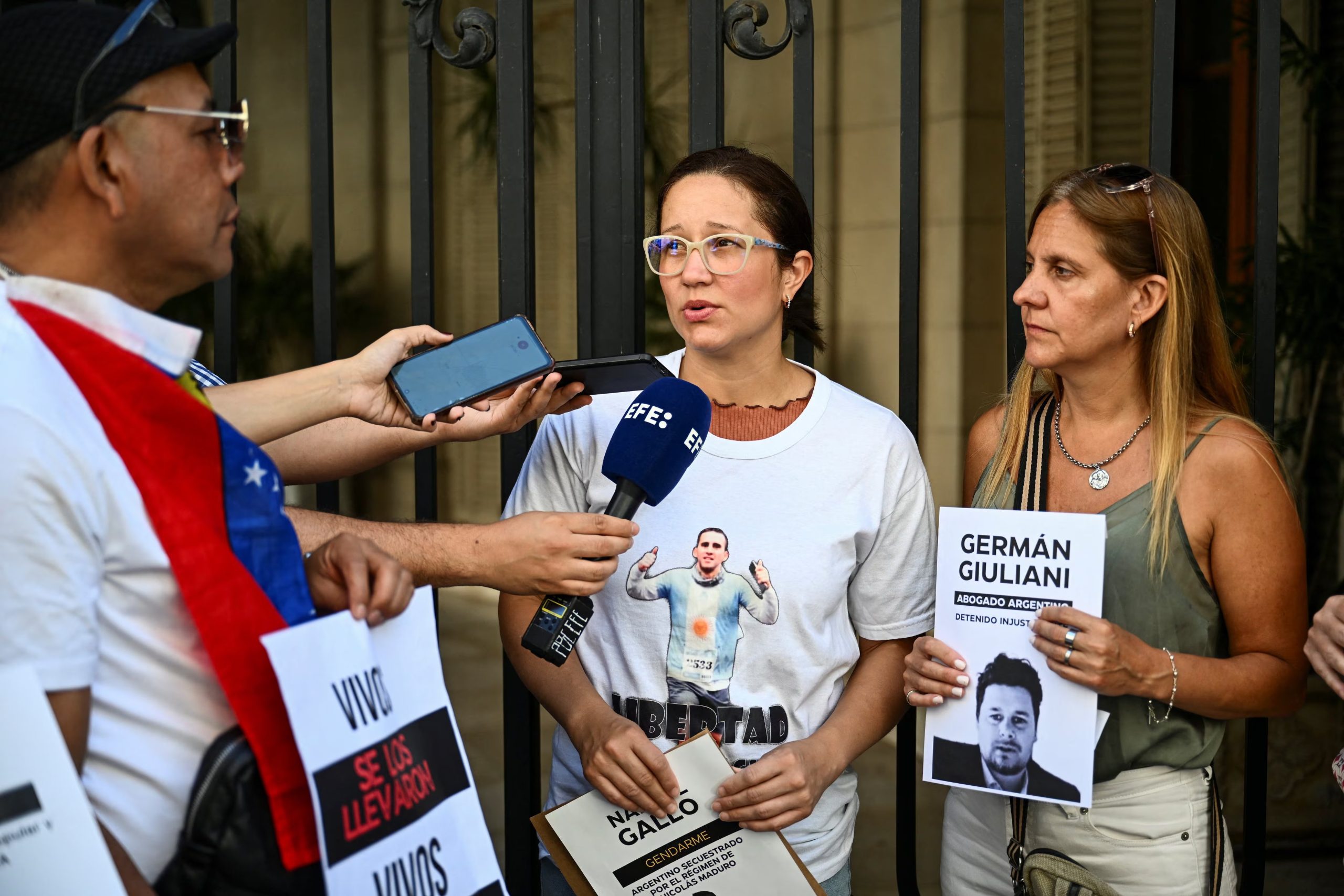 Maria Alexandra Gomez, wife of Nahuel Gallo, an Argentine gendarmerie officer detained in Venezuela since December 2024, talks to the press outside the Apostolic Nunciature along with activists to ask the Vatican to press Venezuelan authorities for the detainees' release, in Buenos Aires, Argentina, January 23, 2026. REUTERS/Pedro Lazaro Fernandez