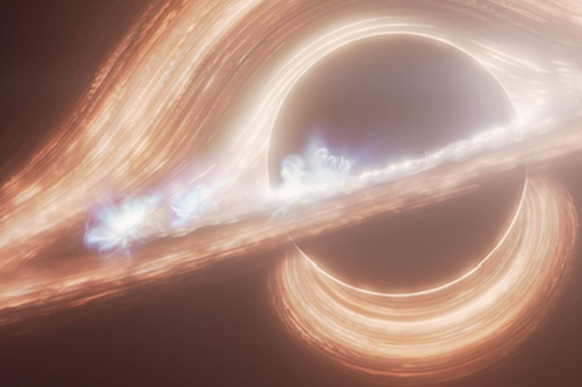 Esta concepción artística retrata el agujero negro supermasivo que se teoriza, se encuentra en el centro de la Vía Láctea. En el disco se ven varios puntos calientes que se asemejan a las erupciones solares, pero a una escala más energética.
(NASA, ESA, CSA, RALF CRAWFORD STSCI)