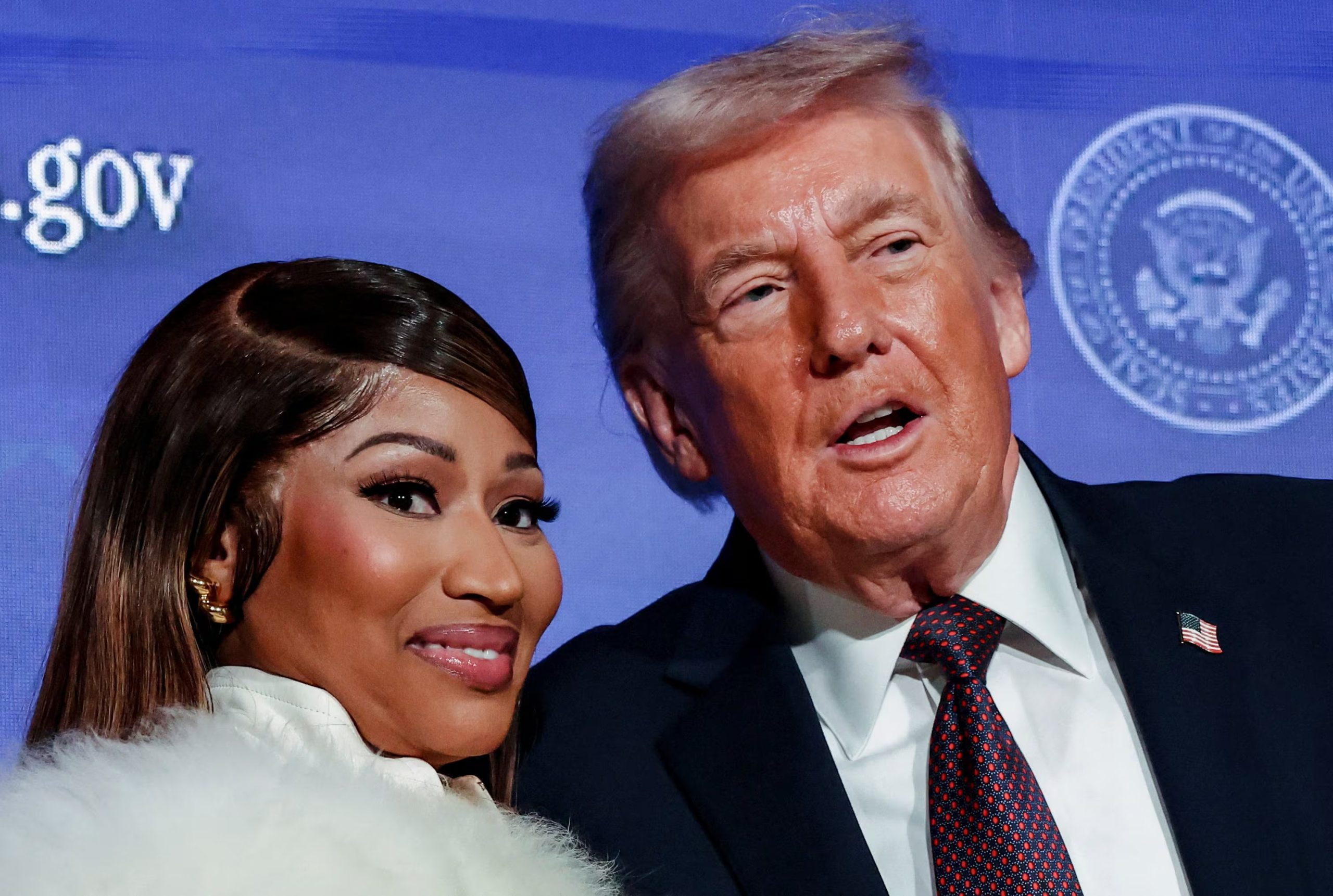 U.S. President Donald Trump and musician Nicki Minaj stand together onstage at the U.S. Treasury Department's Trump Accounts Summit, in Washington, D.C., U.S. January 28, 2026. REUTERS/Kevin Lamarque