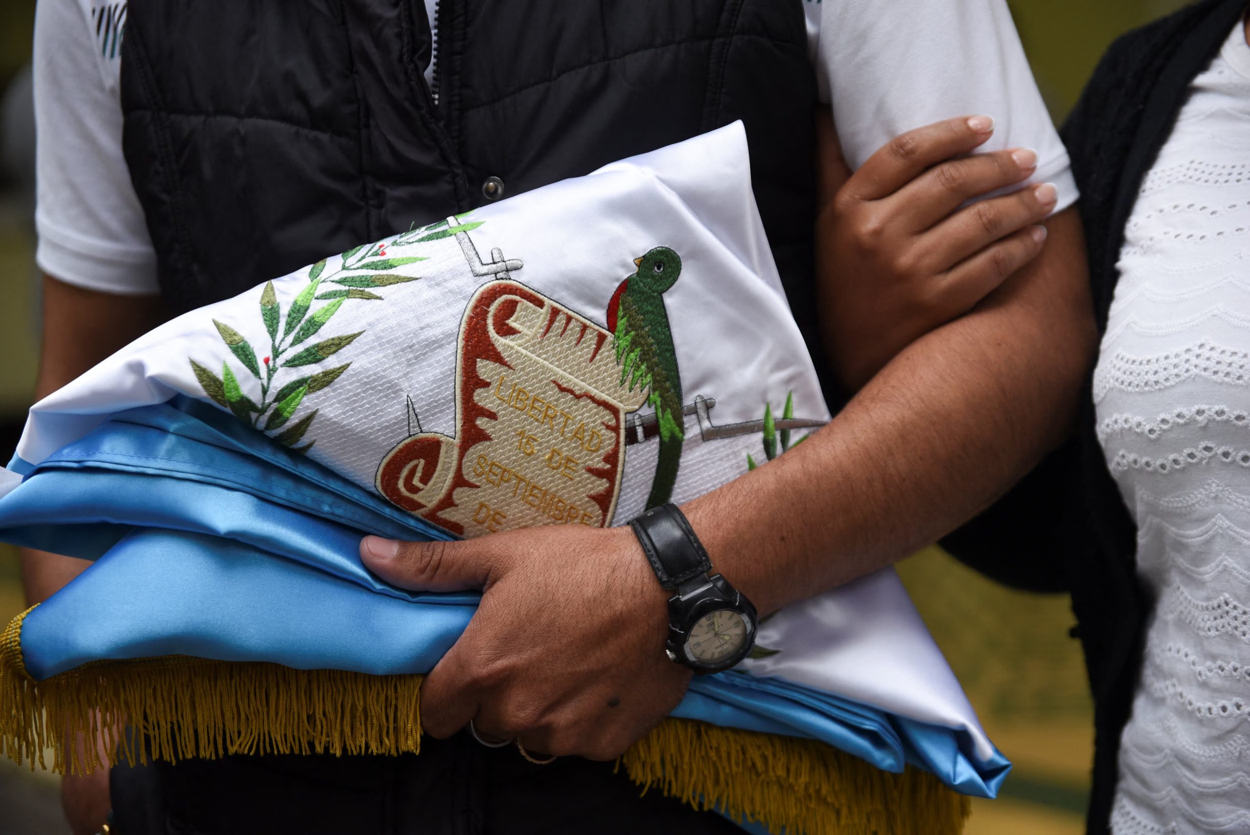 Relatives attend a funeral of a Guatemalan National Civil Police officer who died along with other officers following gang attacks on security forces amid an outbreak of violence that left several people dead and wounded, at the Interior Ministry building in Guatemala City, Guatemala, January 20, 2026. REUTERS/Cristina Chiquin