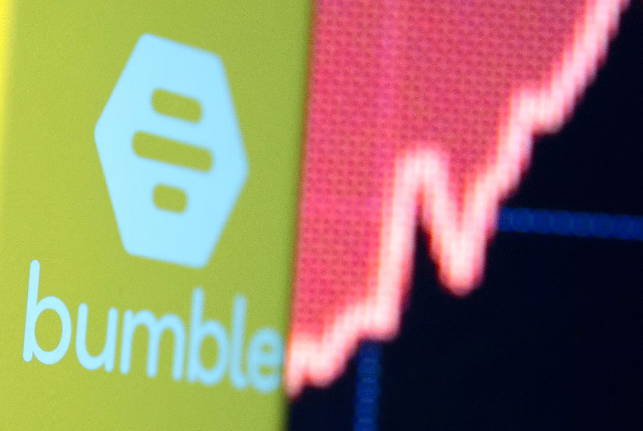 FILE PHOTO: The Bumble logo is seen on a smartphone in front of a stock graph in this illustration taken February 11, 2021. REUTERS/Dado Ruvic/Illustration/File Photo
