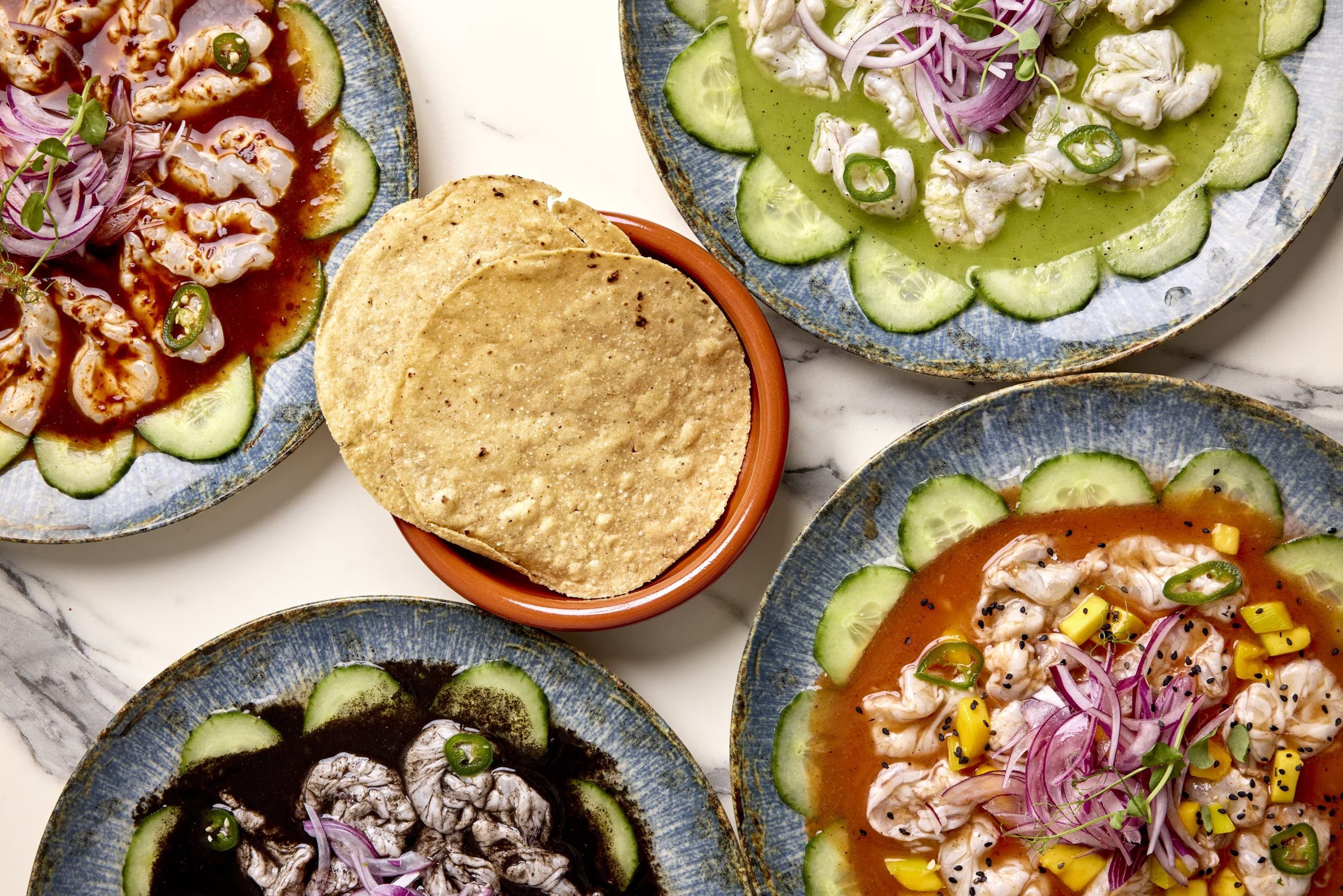 Platos del restaurante Los Aguachiles, en Madrid (Cedida)