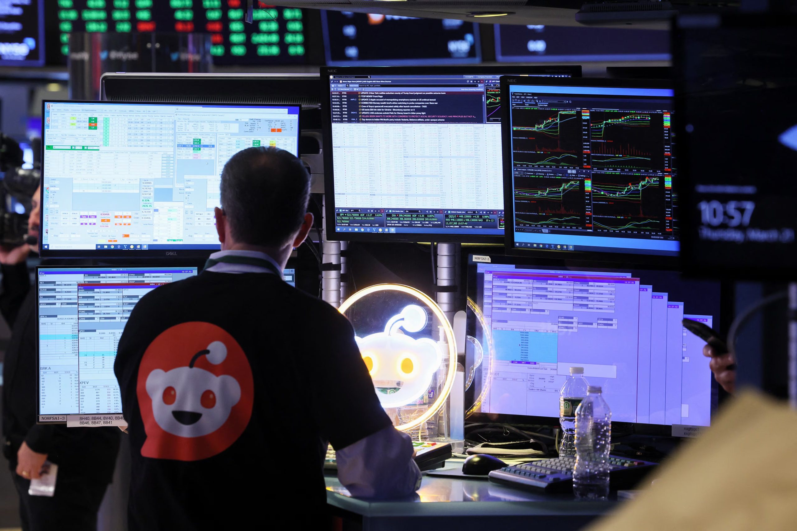 A trader wears a t-shirt with Reddit's logo, at the New York Stock Exchange (NYSE) in New York City, U.S., March 21, 2024. REUTERS/Brendan McDermid