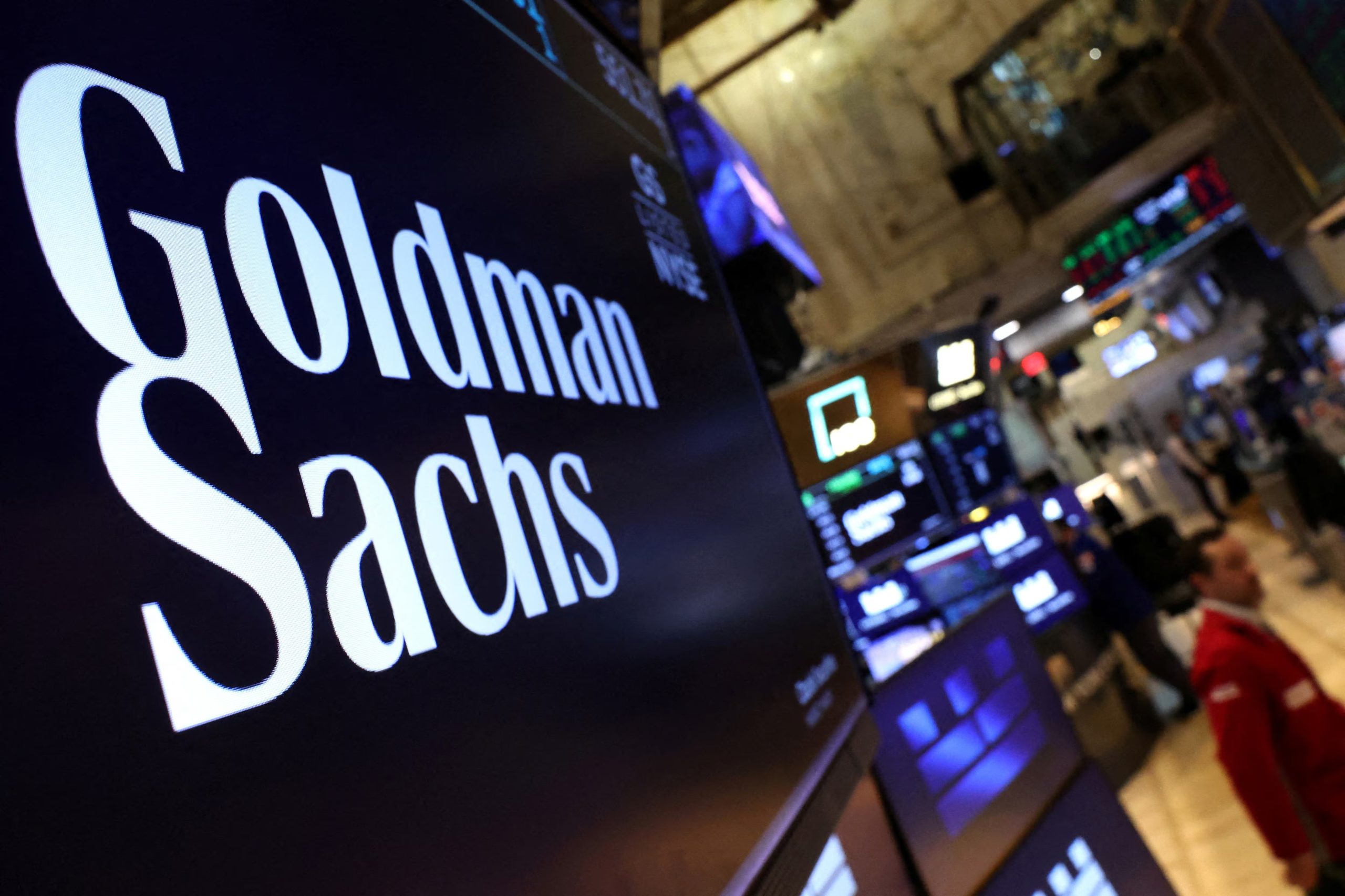 FILE PHOTO: A screen displays the the company logo for Goldman Sachs on the floor at the New York Stock Exchange (NYSE) in New York City, U.S., May 7, 2025. REUTERS/Brendan McDermid/File Photo