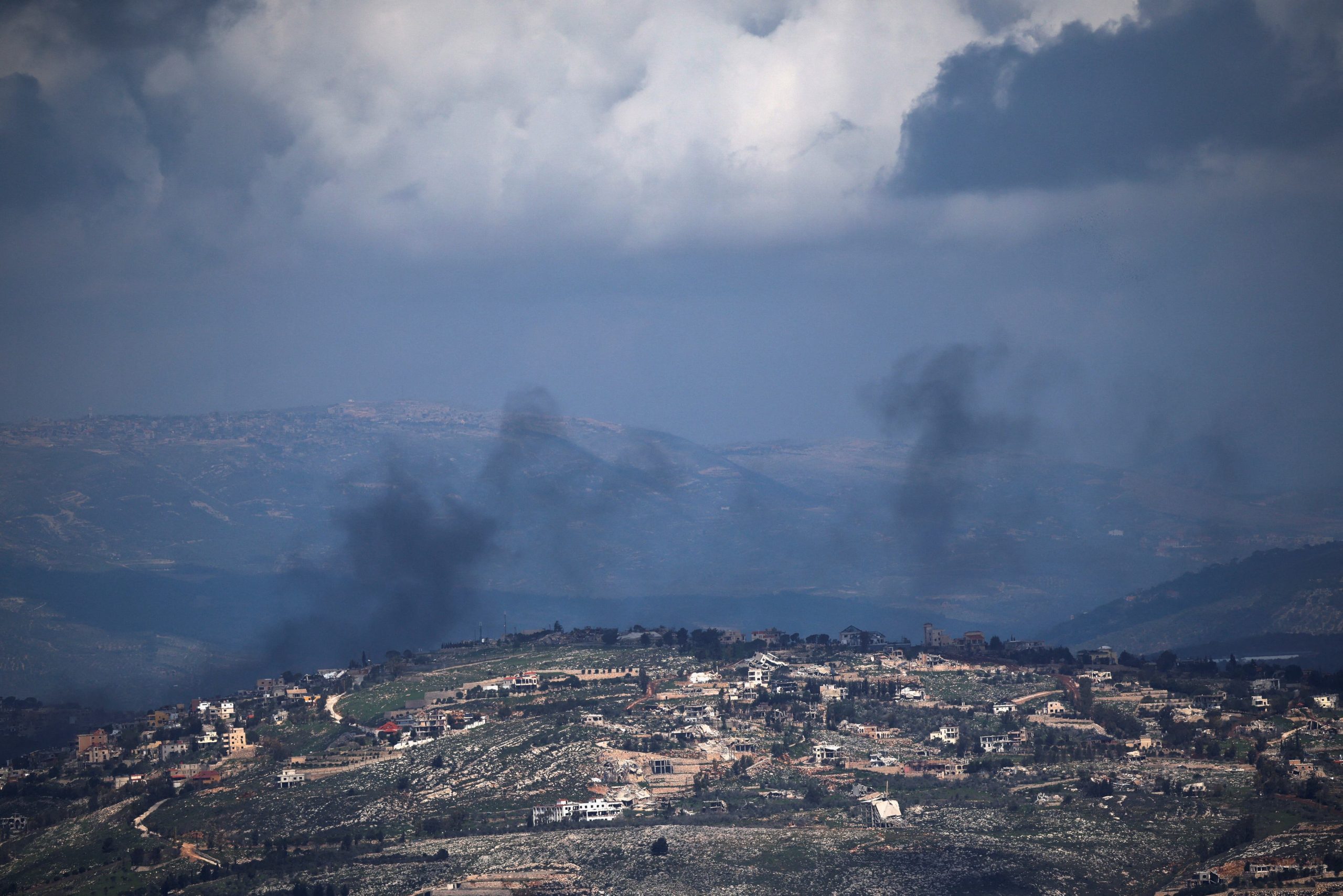Smoke rises from a village in Lebanon following an Israeli strike, amid escalation between Hezbollah and Israel, and amid the U.S.-Israeli conflict with Iran, as seen from northern Israel, March 16, 2026. REUTERS/Shir Torem