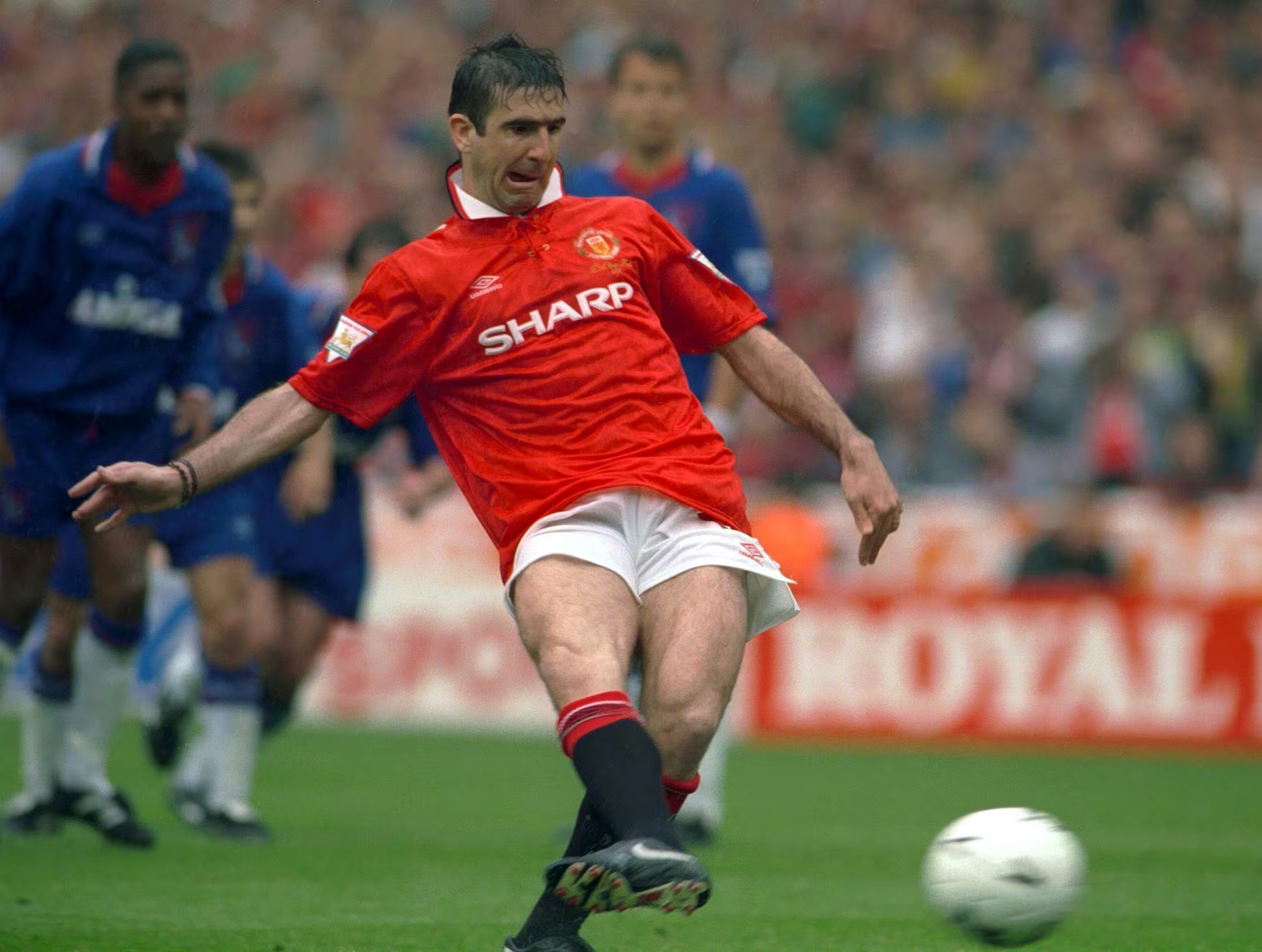 FILE PHOTO: ON THIS DAY -- May 14 May 14, 1994 SOCCER - Manchester United forward Eric Cantona scores from the penalty spot en route to a 4-0 victory against Chelsea in the FA Cup final at Wembley Stadium, London. Man United had already won the Premier League title and Cantona's brace followed by goals from Mark Hughes and Brian McClair ensured they became the fourth team in the 20th century to complete the domestic double. Cantona won nine trophies in his five-year spell with Man United and retired at the end of the 1996-97 season. Action Images via REUTERS/File photo