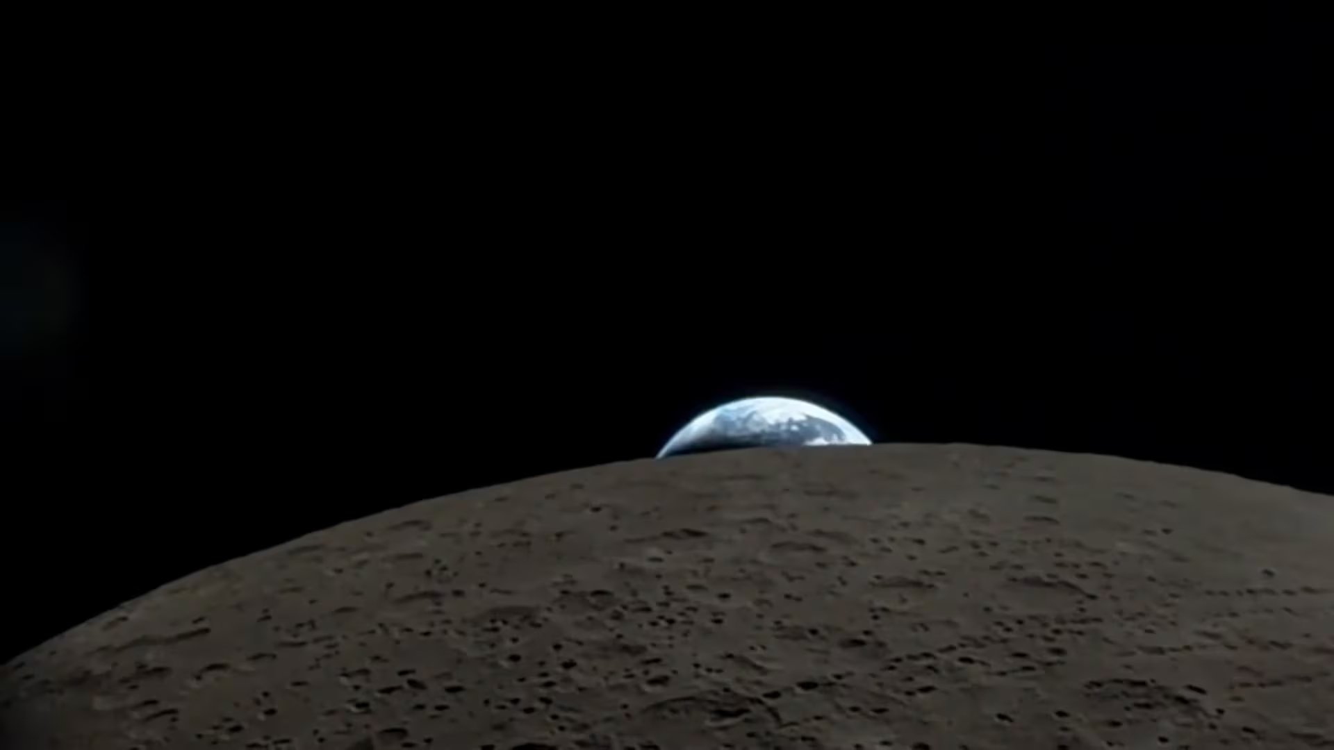 La misión Artemis II de la NASA capta una vista asombrosa de la Tierra asomándose sobre el horizonte lunar, aparentemente 'escondiéndose' detrás de la Luna.