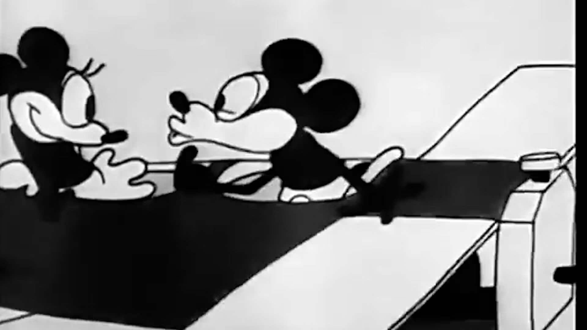 El intento de beso de Mickey Mouse a Minnie Mouse en