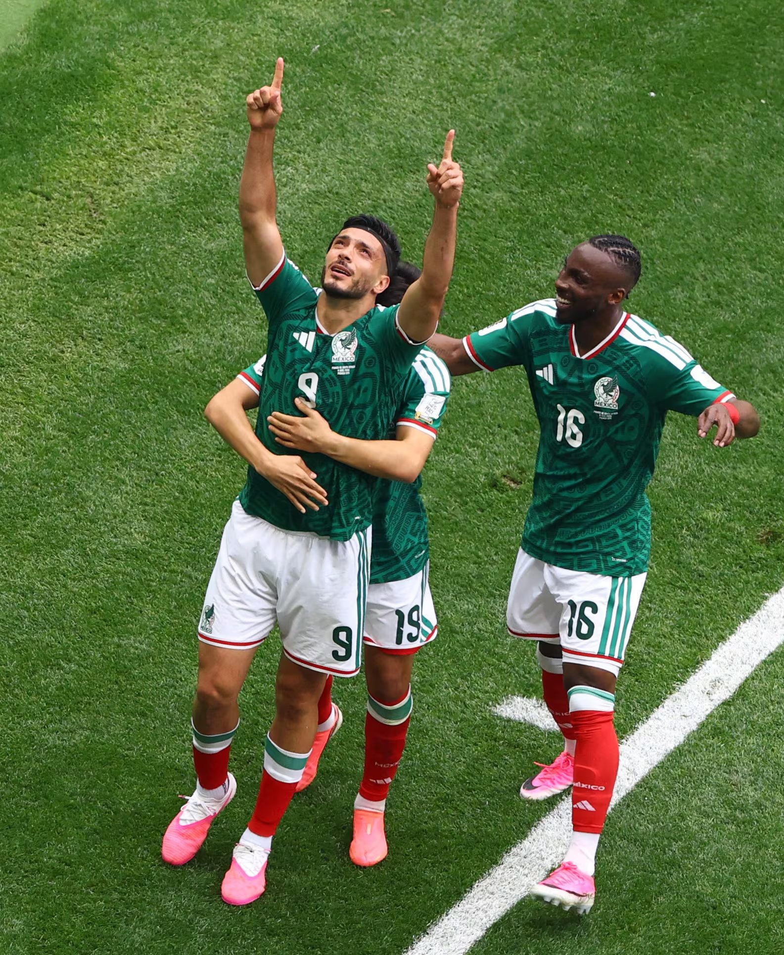Soccer Football - FIFA World Cup 2026 - Group A - Mexico v South Africa - Estadio Azteca, Mexico City, Mexico - June 11, 2026 Mexico's Raul Jimenez celebrates scoring their second goal with Gilberto Mora and Julian Quinones REUTERS/Raquel Cunha