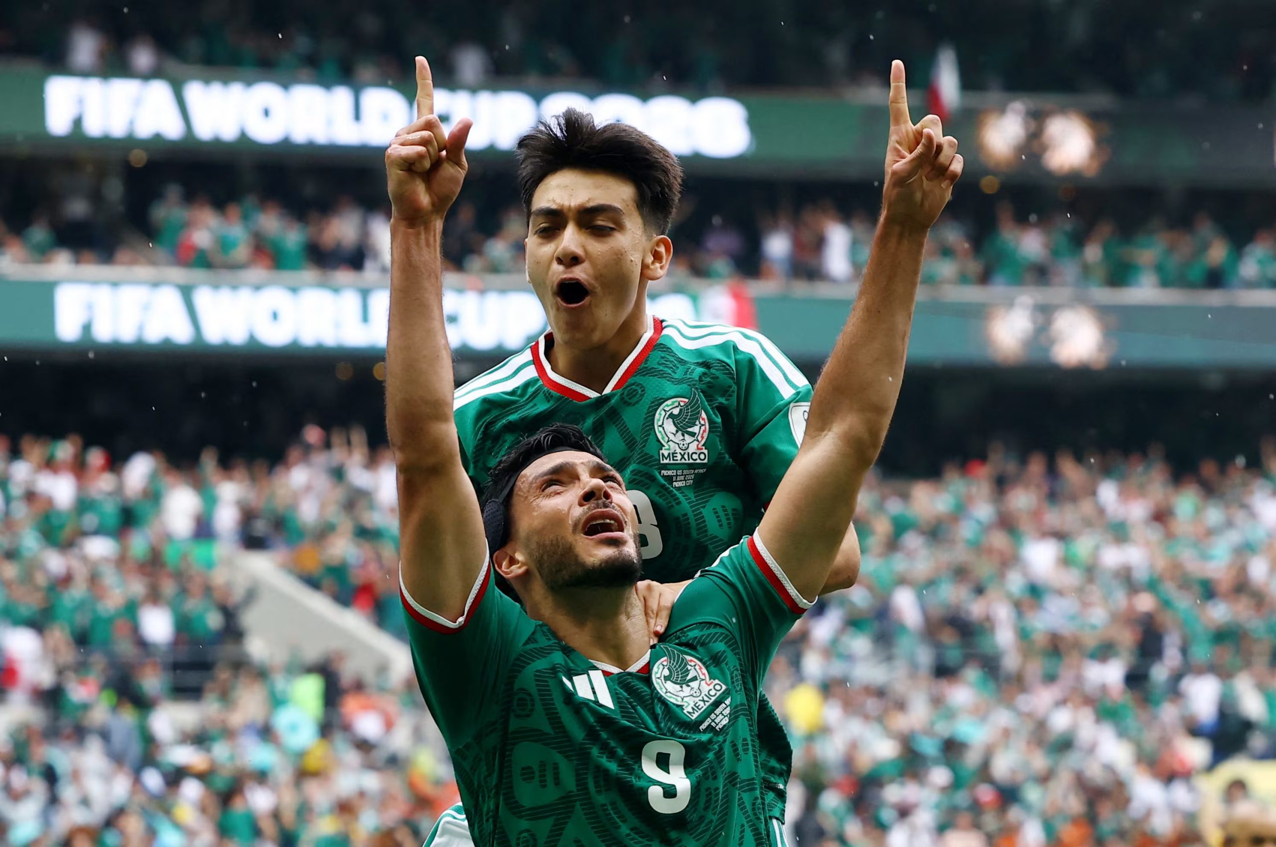 Soccer Football - FIFA World Cup 2026 - Group A - Mexico v South Africa - Estadio Azteca, Mexico City, Mexico - June 11, 2026 Mexico's Raul Jimenez celebrates scoring their second goal with Gilberto Mora REUTERS/Pawel Kopczynski