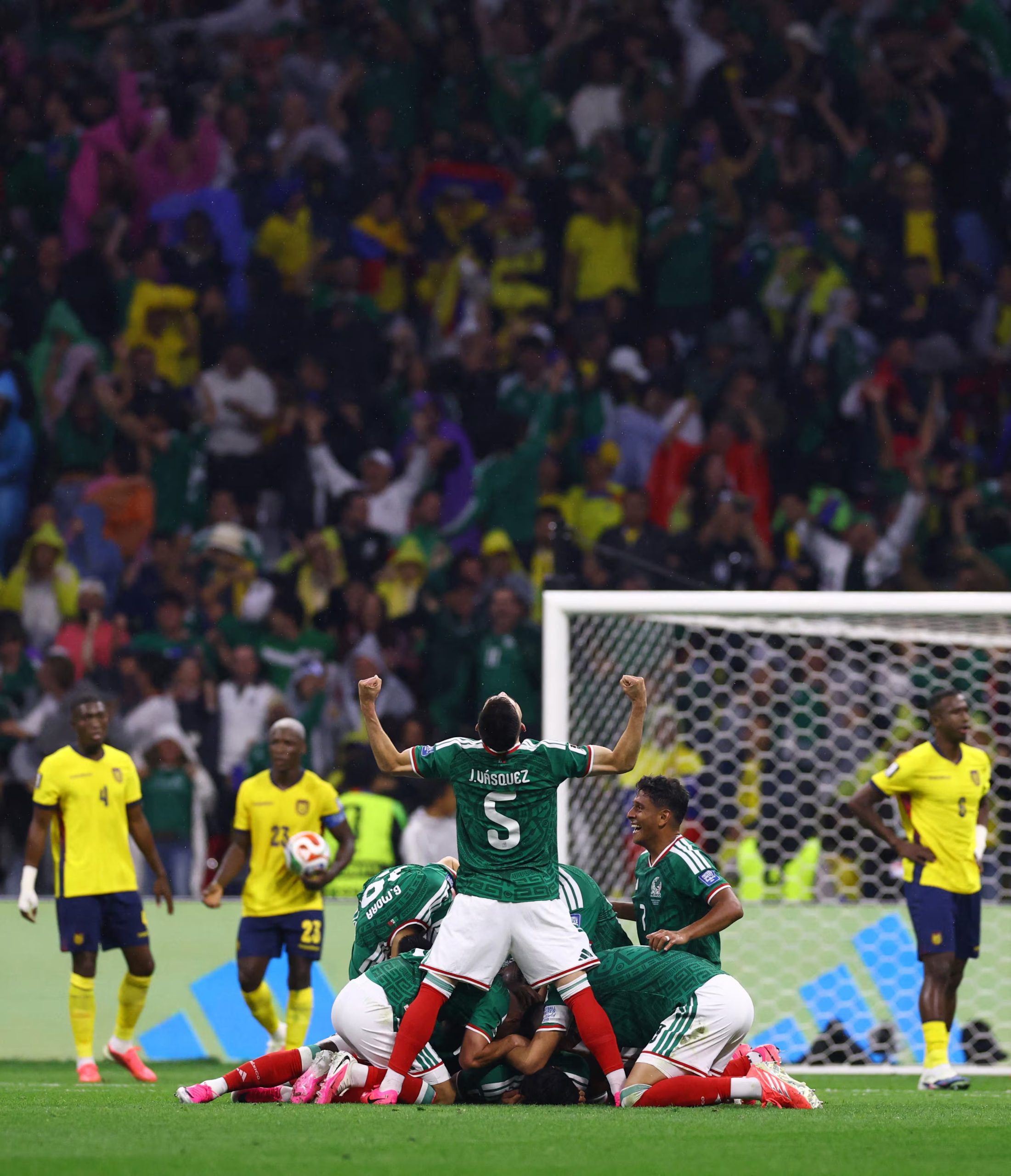 Soccer Football - FIFA World Cup 2026 - Round of 32 - Mexico v Ecuador - Estadio Azteca, Mexico City, Mexico - June 30, 2026 Mexico's Raul Jimenez celebrates scoring their second goal with Johan Vasquez and teammates next as Ecuador players look dejected REUTERS/Raquel Cunha