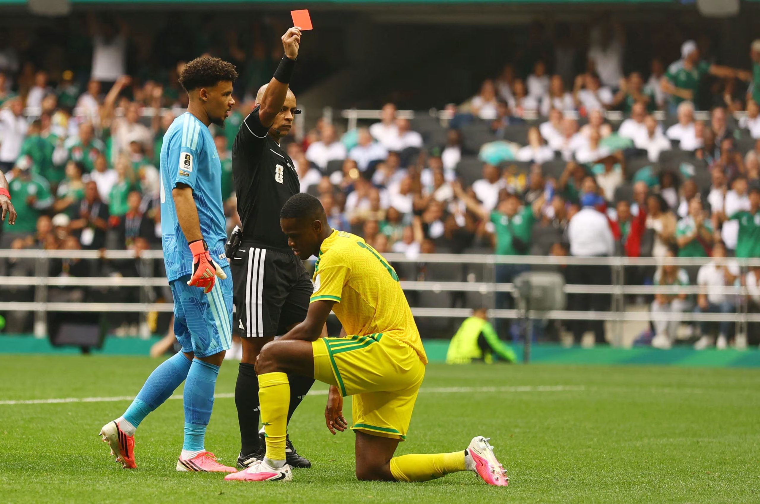 Soccer Football - FIFA World Cup 2026 - Group A - Mexico v South Africa - Estadio Azteca, Mexico City, Mexico - June 11, 2026 South Africa's Sphephelo Sithole is shown a red card by referee Wilton Sampaio REUTERS/Hannah Mckay