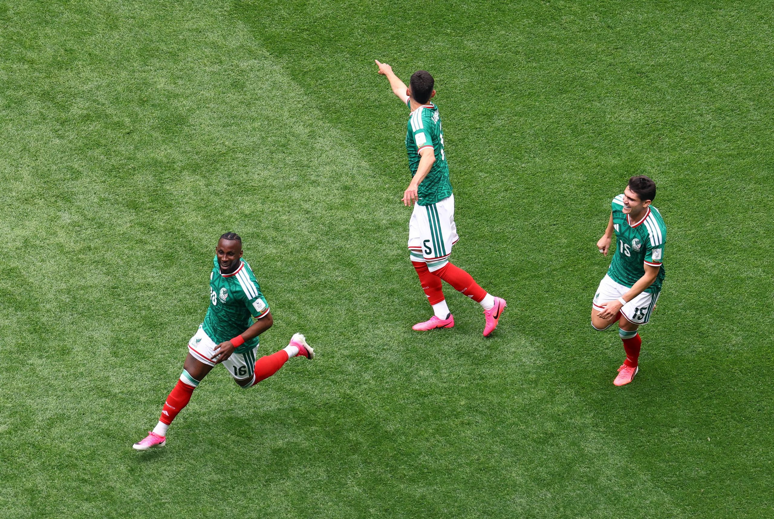 Soccer Football - FIFA World Cup 2026 - Group A - Mexico v South Africa - Estadio Azteca, Mexico City, Mexico - June 11, 2026 Mexico's Julian Quinones celebrates scoring their first goal with Roberto Alvarado and Israel Reyes REUTERS/Raquel Cunha
