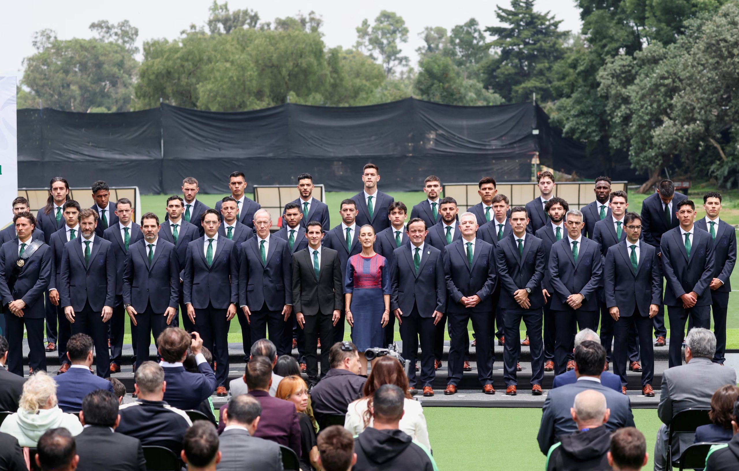 Mexican soccer players stand with Mexican President Claudia Sheinbaum, as part of a ceremony for Mexico's national soccer team, which will represent the country at the 2026 FIFA World Cup co-hosted by the United States, Canada and Mexico, at the Centro de Alto Rendimiento (CAR) in Mexico City, Mexico, June 8, 2026. REUTERS/Luis Cortes
