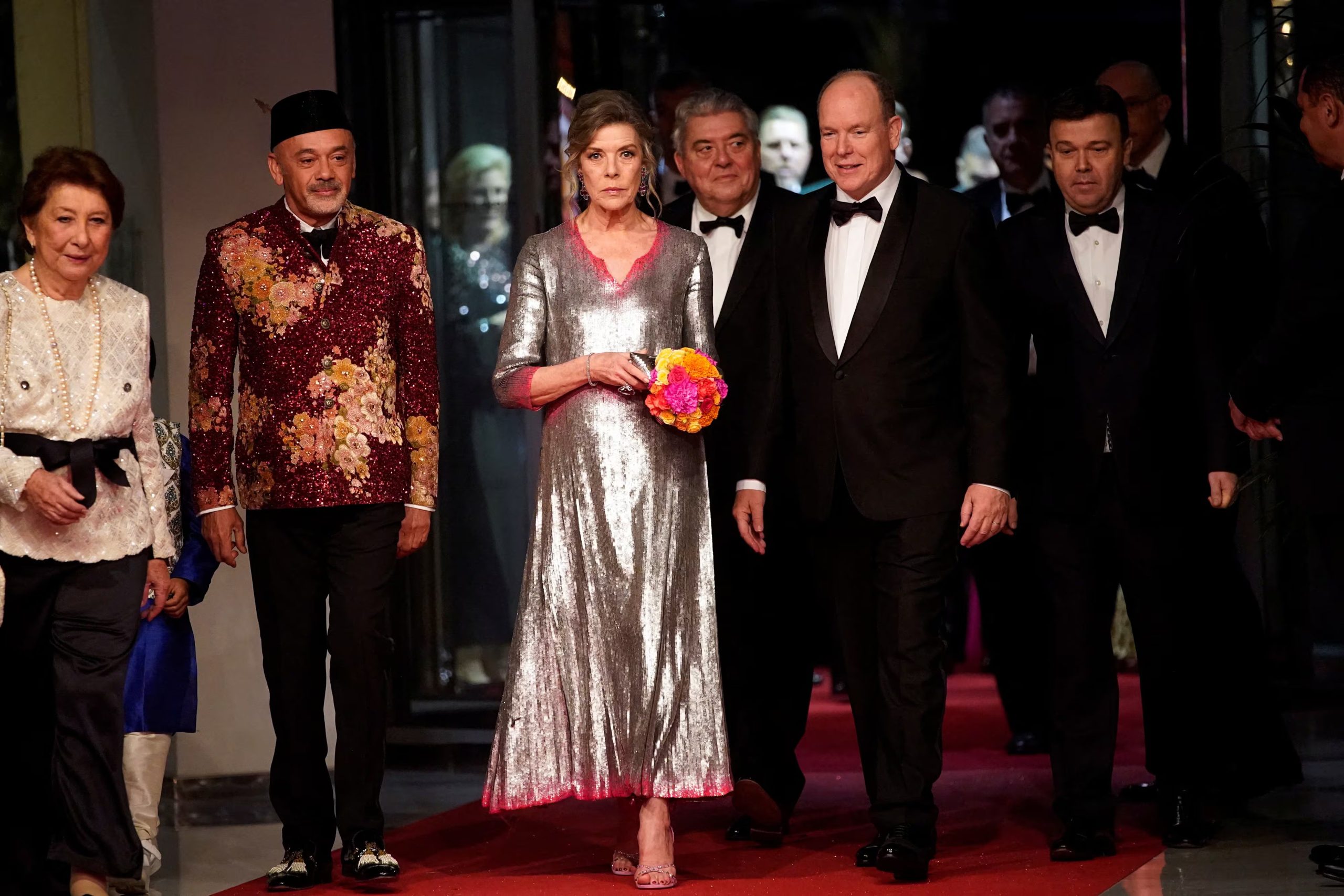Christian Louboutin, second from left, Princess Caroline of Hanover, Prince Albert II of Monaco, and Stephane Valeri attend the 'Bal de la Rose' (Rose Ball), in Monaco, March 25, 2023. Daniel Cole/Pool via REUTERS