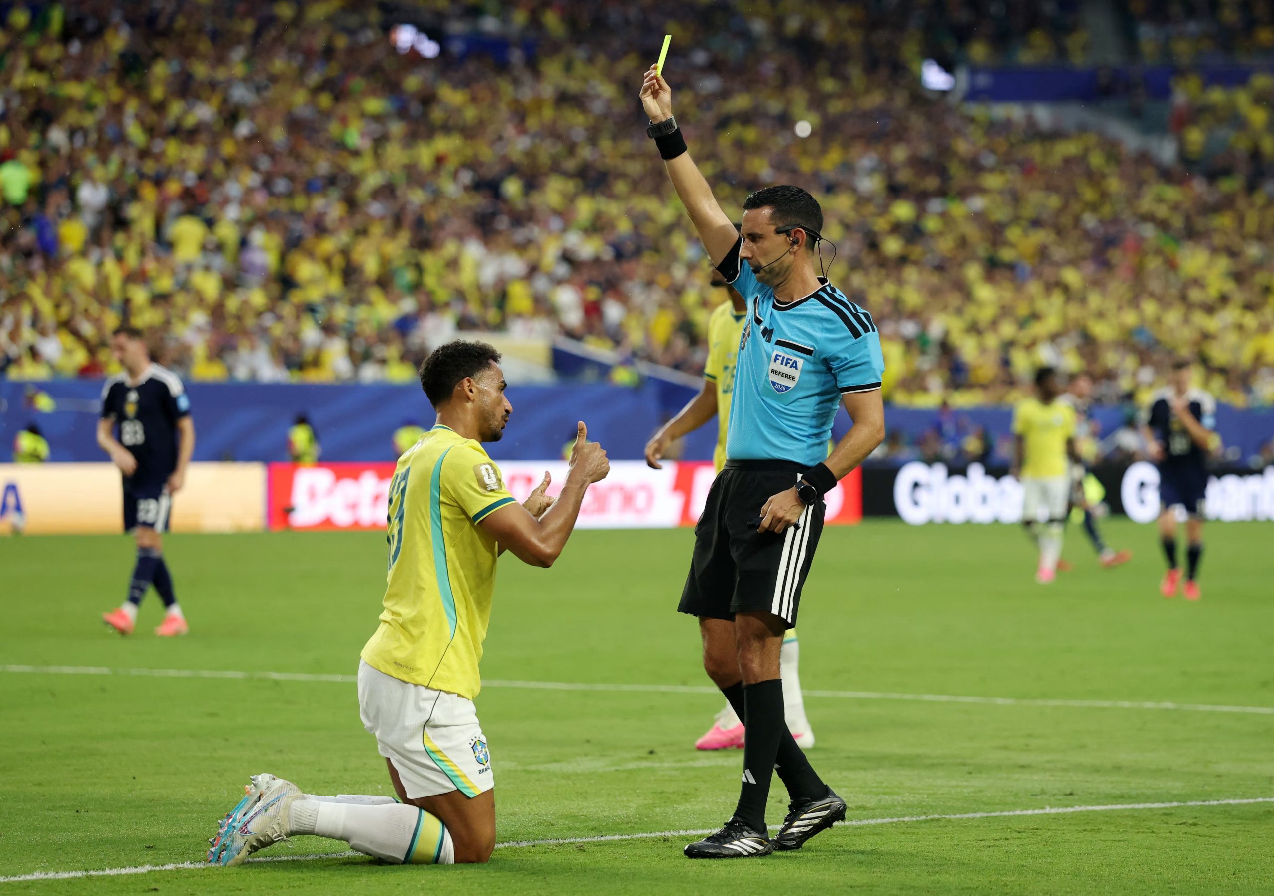 Soccer Football - FIFA World Cup 2026 - Group C - Scotland v Brazil - Miami Stadium, Miami Gardens, Florida, U.S. - June 24, 2026 Brazil's Danilo is shown a yellow card by referee Cesar Arturo Ramos Palazuelos REUTERS/Paul Childs