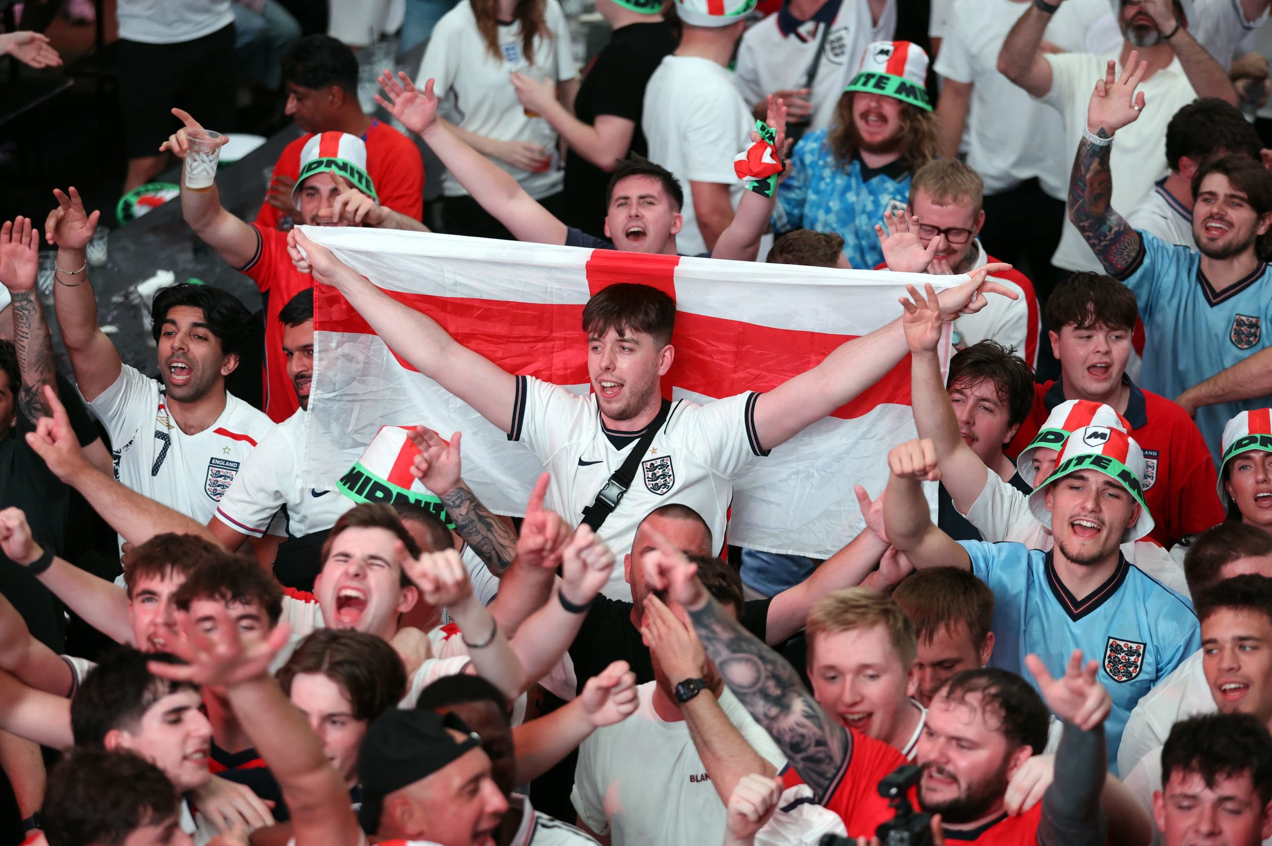 Soccer Football - FIFA World Cup 2026 - Round of 32 - England v DR Congo - Fans gather in London - BOXPARK Wembley, London, Britain - July 1, 2026 England fans celebrates after the match at BOXPARK Wembley as England qualify for the Round of 16 stage of the World Cup Action Images via Reuters/Cat Goryn