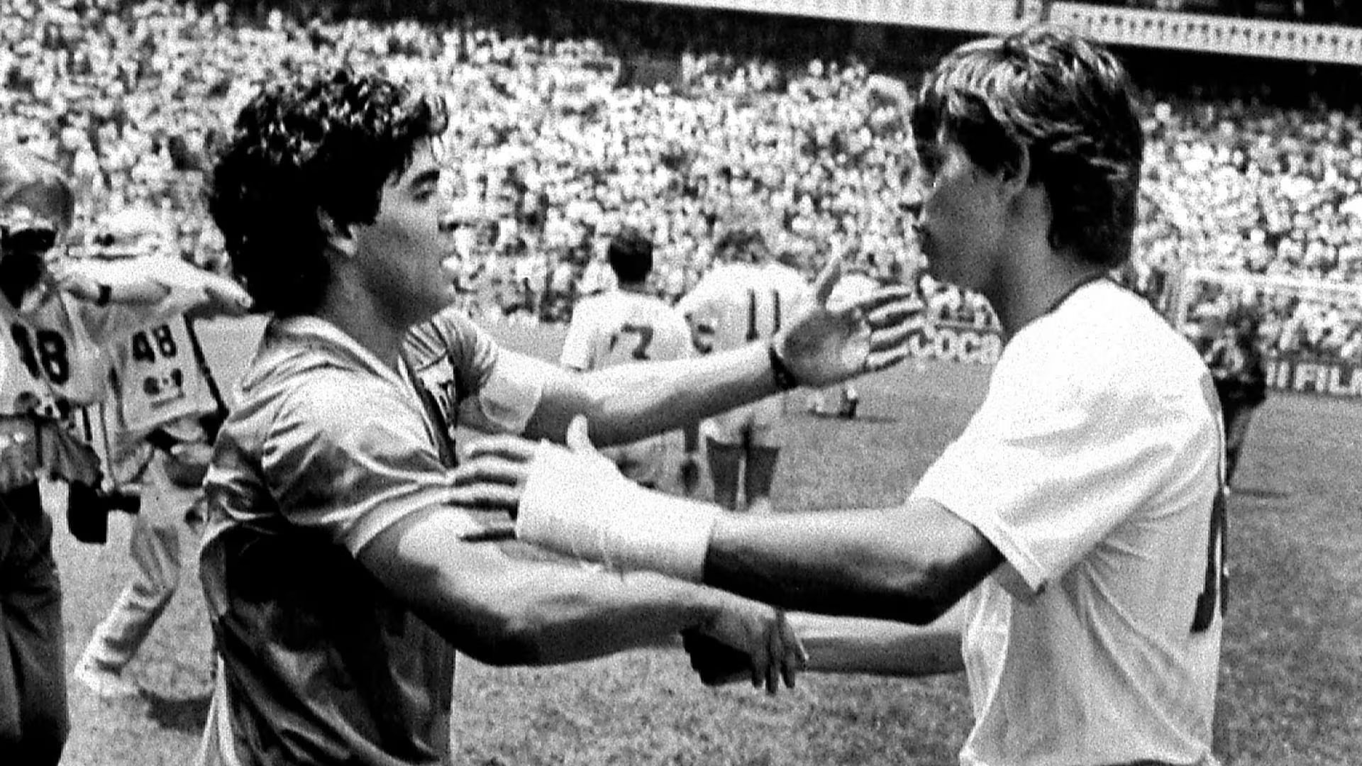 Argentine World Cup star Diego Maradona (L) is greeted by England's Gary Lineker (R) on the pitch following their World Cup quarter final in Mexico, June 22, 1986. Maradona scored both goals in Argentina's 2-1 victory. REUTERS/Lars Nyberg-Expressen SWEDEN OUT AS