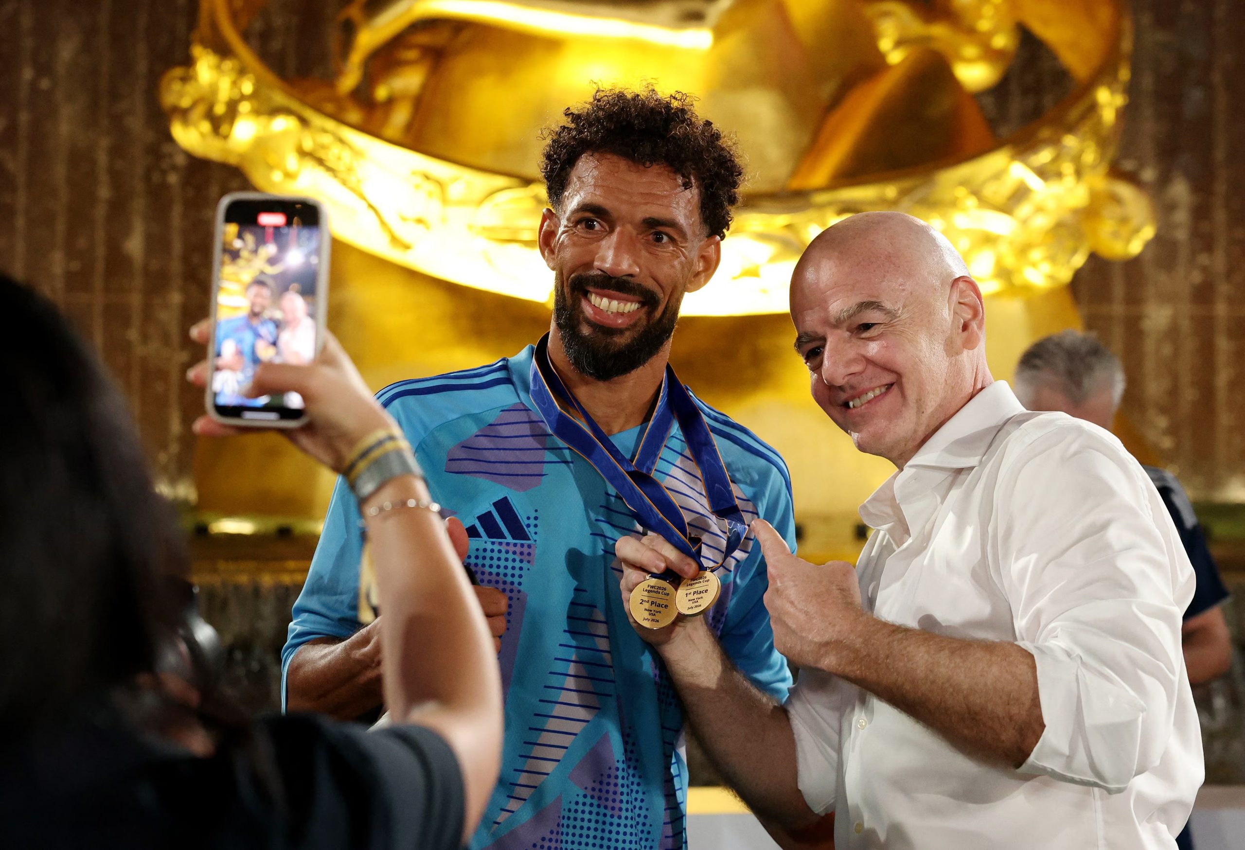 Soccer Football - FIFA World Cup 2026 - FIFA Legends Match - Rockefeller Center, New York City, New York, U.S. - July 17, 2026 FIFA President Gianni Infantino poses for a picture with Cape Verde's Vozinha after the match REUTERS/John Sibley