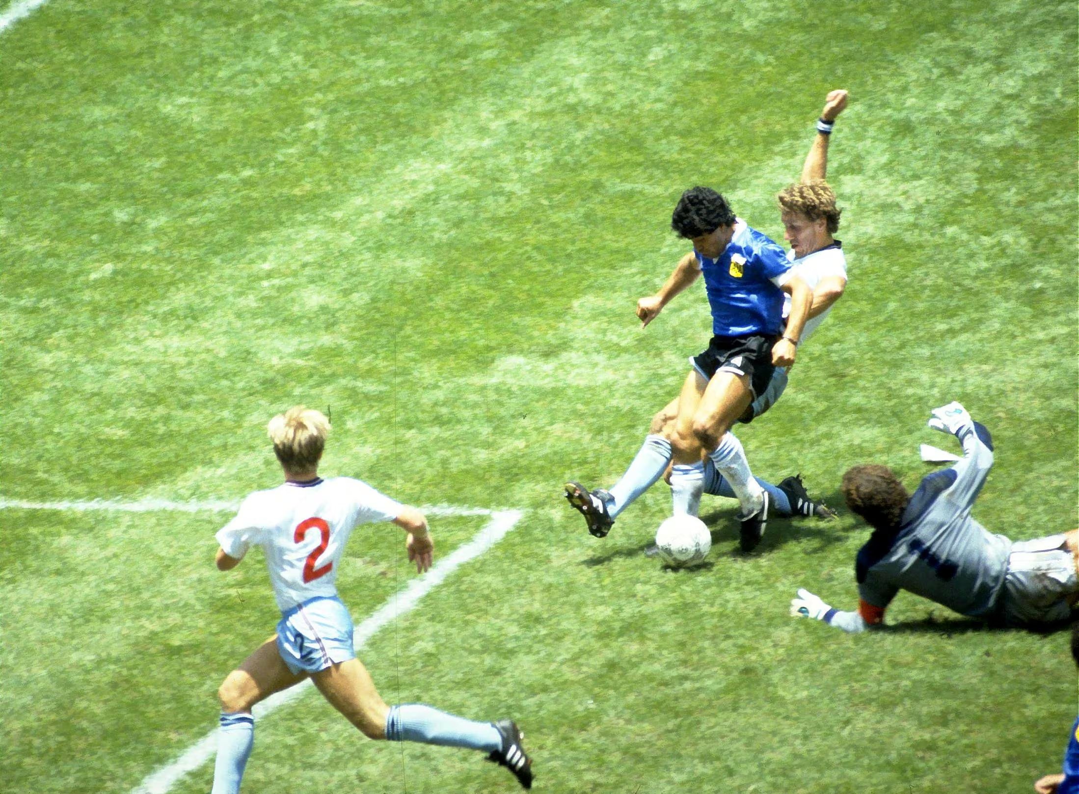 FILE PHOTO: Football - 1986 FIFA World Cup - Quarter Final - England v Argentina - Azteca Stadium, Mexico City - 22/6/86 Diego Maradona scores for Argentina. Mandatory Credit: Action Images / Juha Tamminen/File Photo