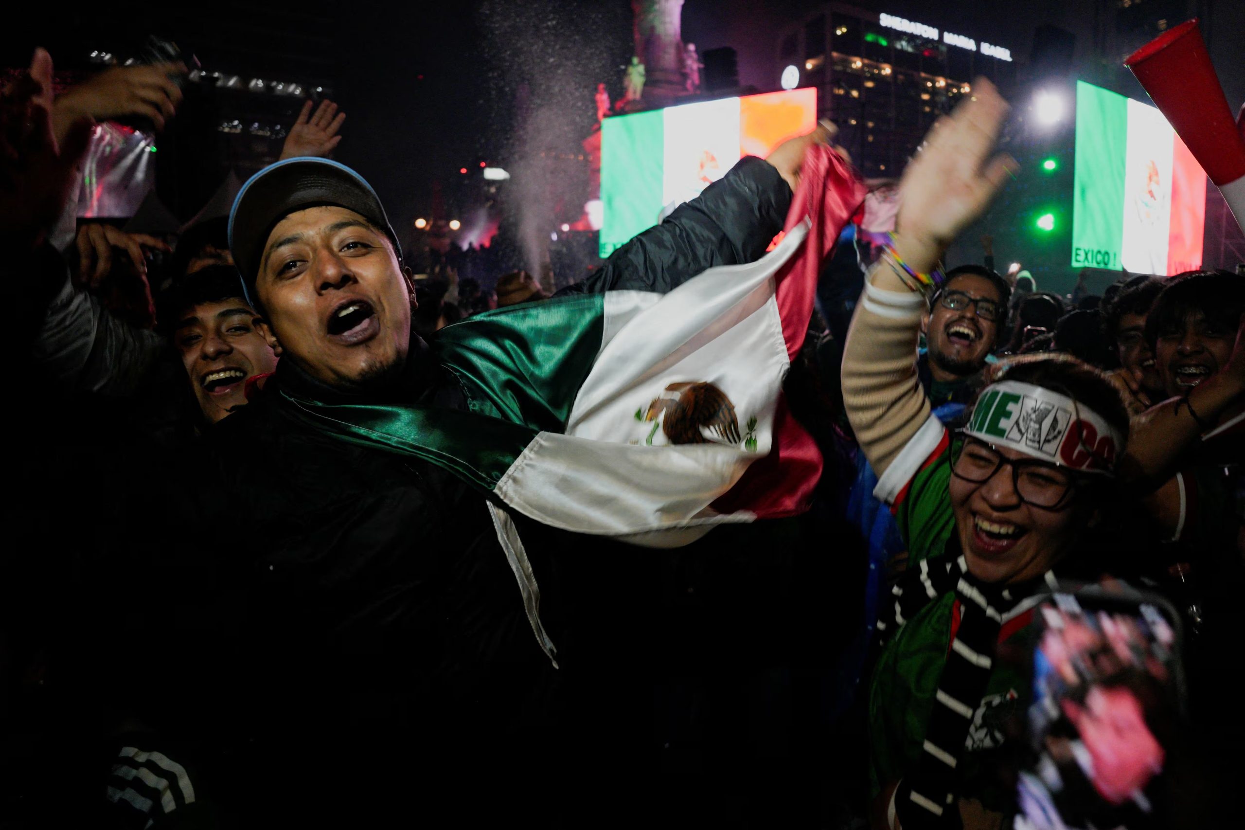 Soccer Football - FIFA World Cup 2026 - Round of 32 - Mexico v Ecuador - Mexico City, Mexico - June 30, 2026 Supporters of Mexico celebrate after Mexico won their game REUTERS/Armando Vega