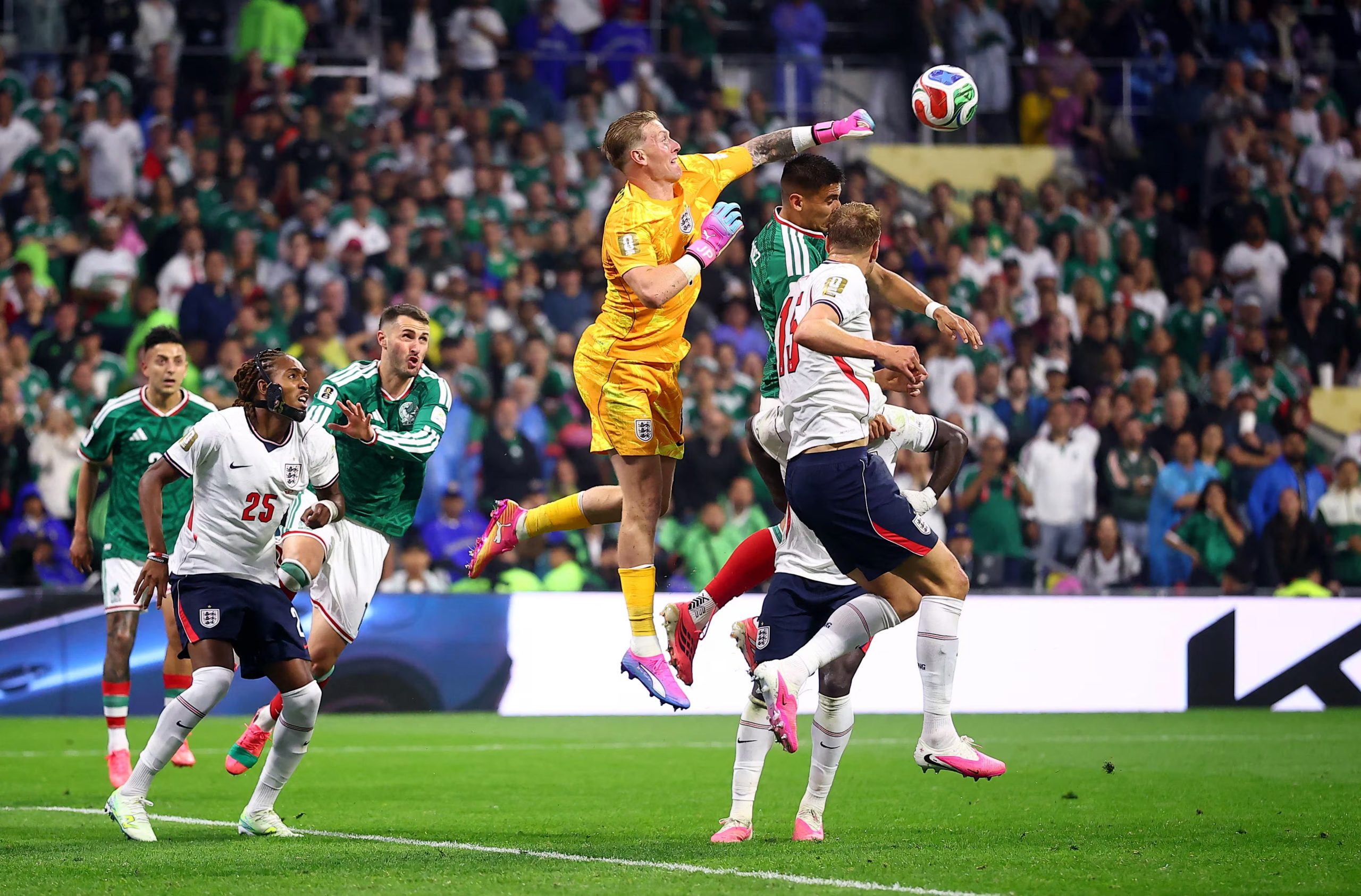 Soccer Football - FIFA World Cup 2026 - Round of 16 - Mexico v England - Estadio Azteca, Mexico City, Mexico - July 5, 2026 Mexico's Guillermo Martinez in action with England's Marc Guehi, Dan Burn and Jordan Pickford REUTERS/Eloisa Sanchez