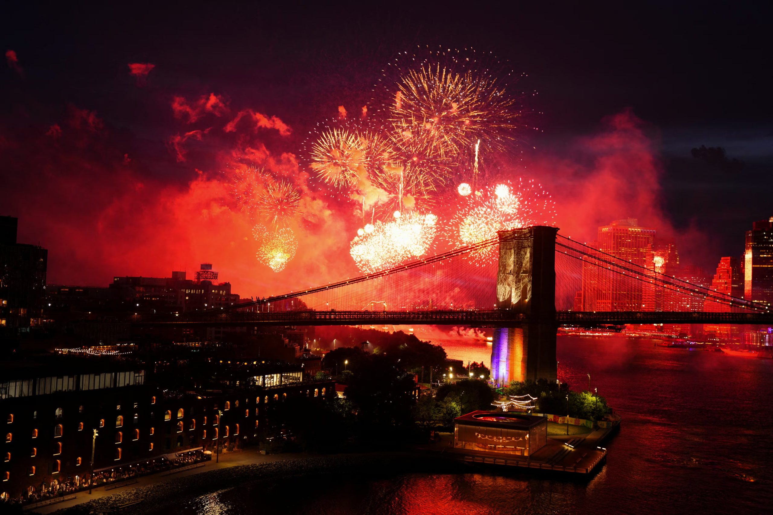 Fireworks explode over the Brooklyn Bridge as the United States celebrates its 250th anniversary on Independence Day in New York City, U.S., July 4, 2026. REUTERS/Angelina Katsanis