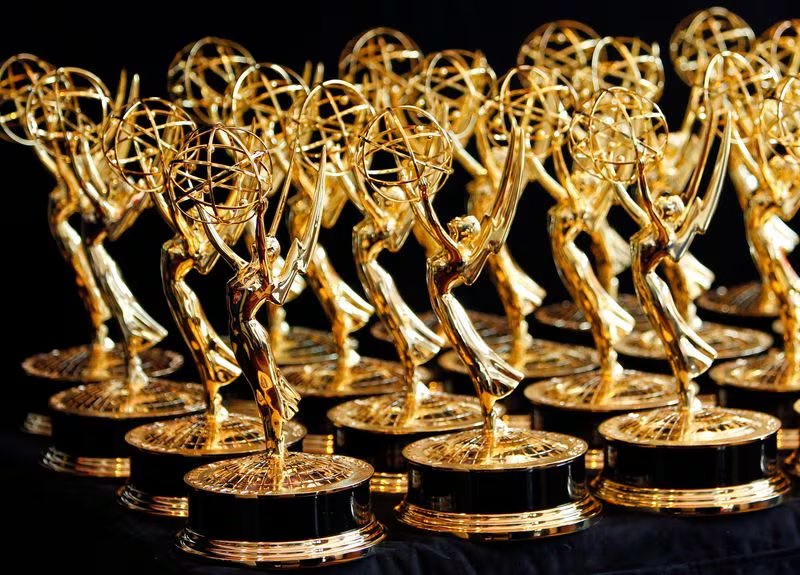 FILE PHOTO: Dozens of Emmy Awards are lined up on the trophy table in the media center at the 62nd annual Primetime Emmy Awards in Los Angeles, California August 29, 2010. REUTERS/Danny Moloshok