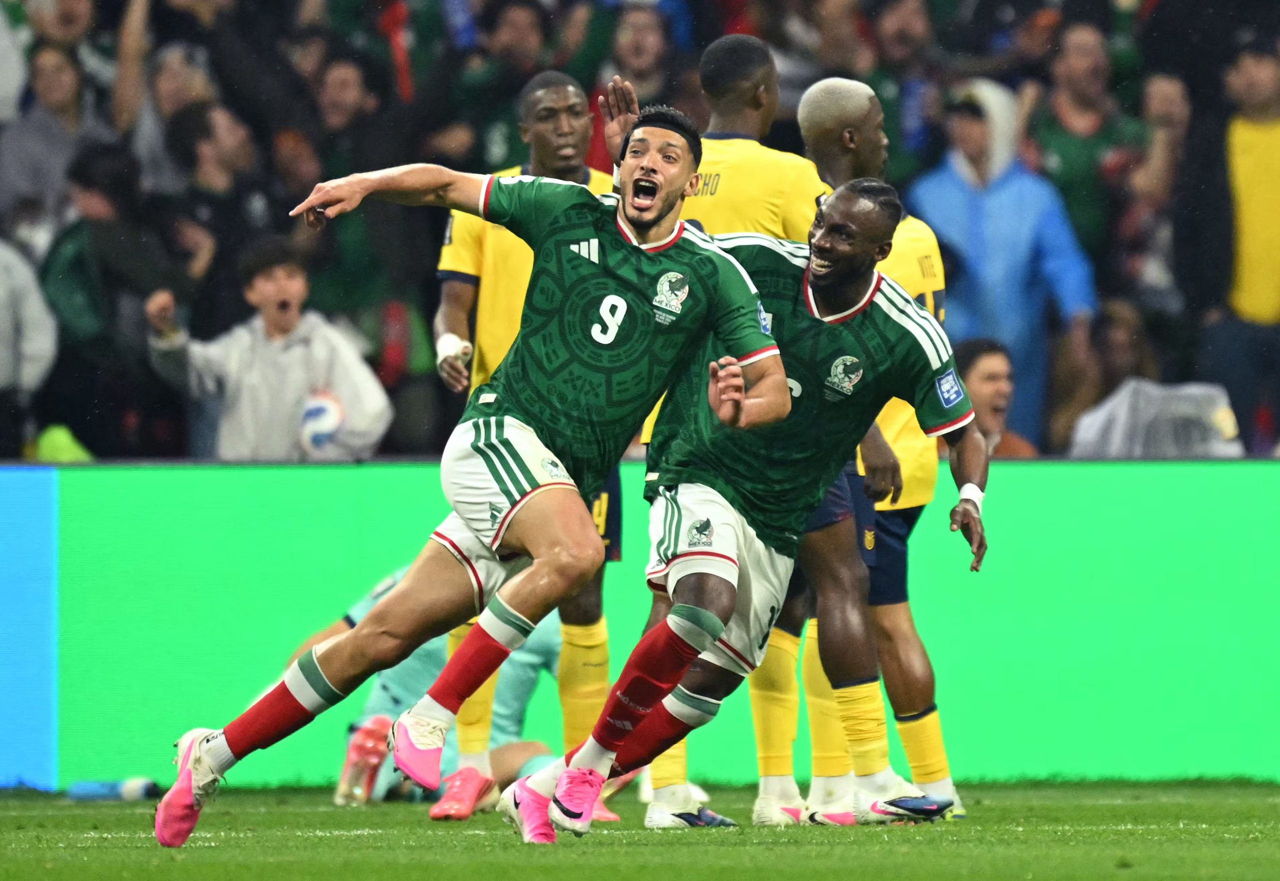 Mexico's forward #09 Raul Jimenez celebrates scoring his team's second goal with forward #16 Julian Quinones during the 2026 World Cup round of 32 football match between Mexico and Ecuador at the Mexico City Stadium in Mexico City on June 30, 2026. (Photo by Yuri CORTEZ / AFP)