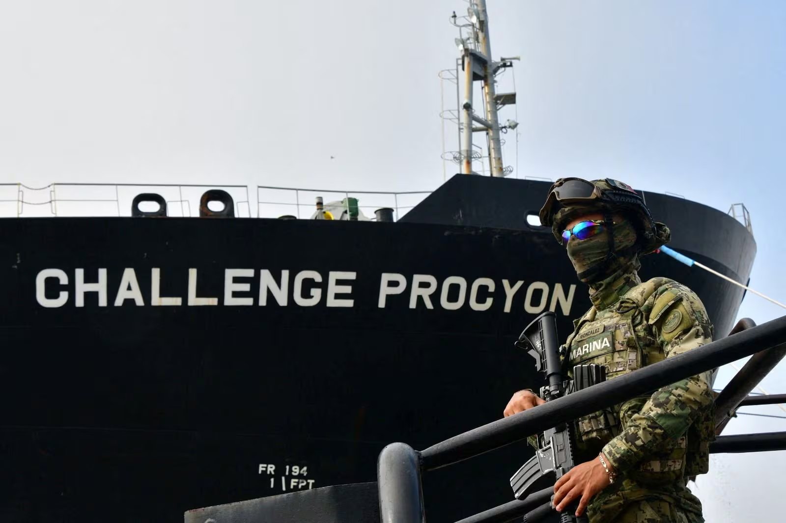 A member of the Mexican Navy stands in front of the petroleum tanker Challenge Procyon, seized by authorities in the Port of Tampico after arriving from the U.S. under suspicion of involvement in the illicit trade of fuels, with nearly 63,000 barrels of diesel, according to security authorities, in Tampico, Mexico, in this handout photo distributed on March 31, 2025. Secretaria de Marina (SEMAR)/Handout via REUTERS ATTENTION EDITORS - THIS IMAGE HAS BEEN SUPPLIED BY A THIRD PARTY. NO RESALES. NO ARCHIVES. BEST QUALITY AVAILABLE