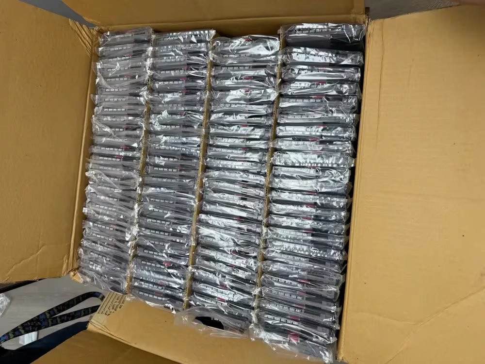 This photo provided by Nintendo Wire shows a box of nearly 100 uncirculated Nintendo Entertainment System copies of Super Mario Bros. and Duck Hunt on Wednesday, June 17, 2026, rediscovered in a warehouse in Waukesha, Wis., by OneStopWonders store owner Kevin Braun and Nintendo Wire publisher Jason Ganos. (Jason Ganos/Nintendo Wire via AP) 