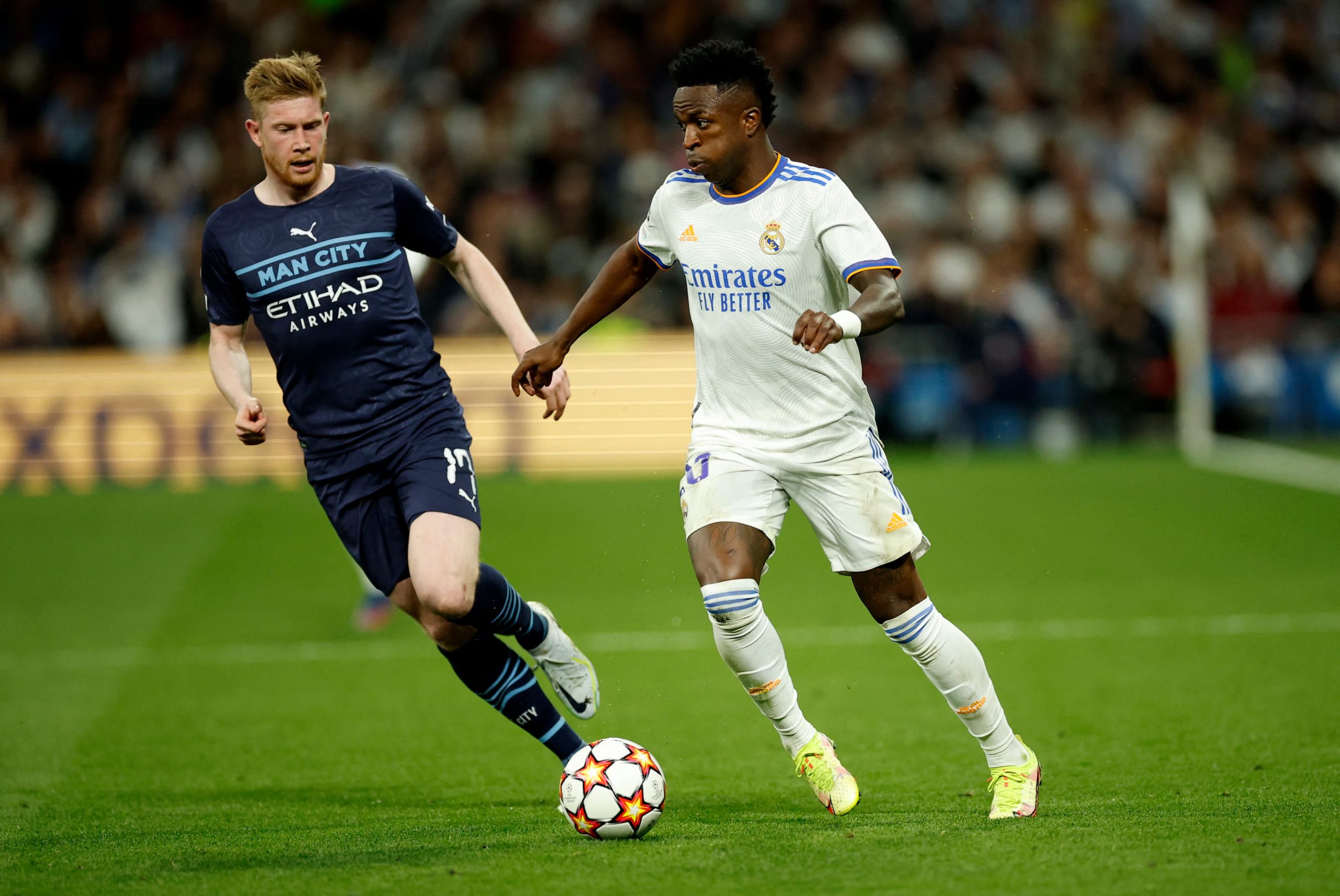 Soccer Football - Champions League - Semi Final - Second Leg - Real Madrid v Manchester City - Santiago Bernabeu, Madrid, Spain - May 4, 2022 Real Madrid's Vinicius Junior in action with Manchester City's Kevin De Bruyne REUTERS/Juan Medina