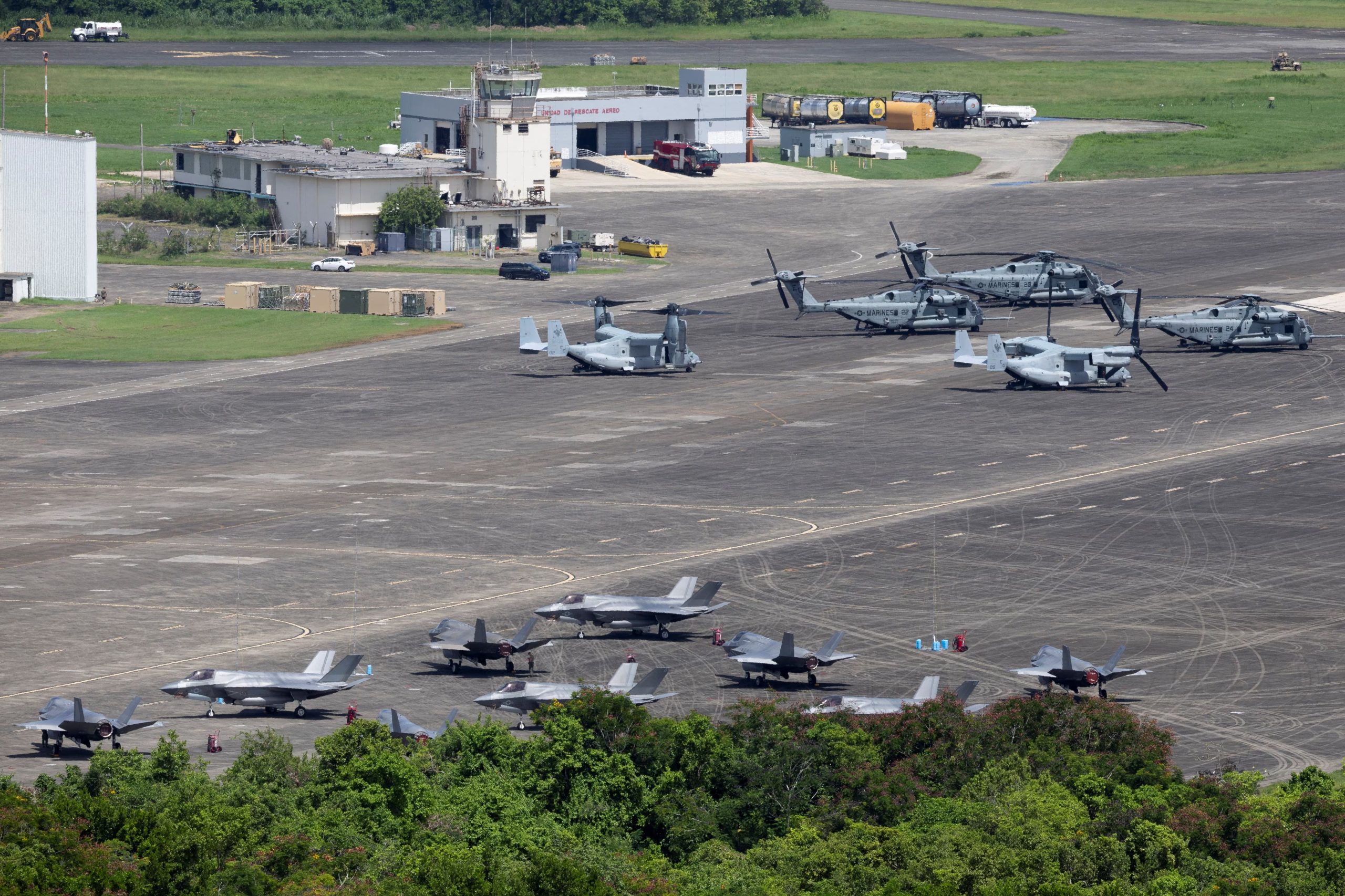 U.S. Marine Corps F-35 fighter jets, Osprey aircraft and helicopters stand parked on the tarmac at the former Roosevelt Roads military base in Ceiba, Puerto Rico, September 14, 2025. REUTERS/Ricardo Arduengo