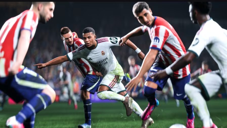 Kylian Mbappé, vistiendo la camiseta del Real Madrid, disputa el balón rodeado por jugadores del Atlético de Madrid en una gráfica de EA Sports FC. (EA Sports FC 27)