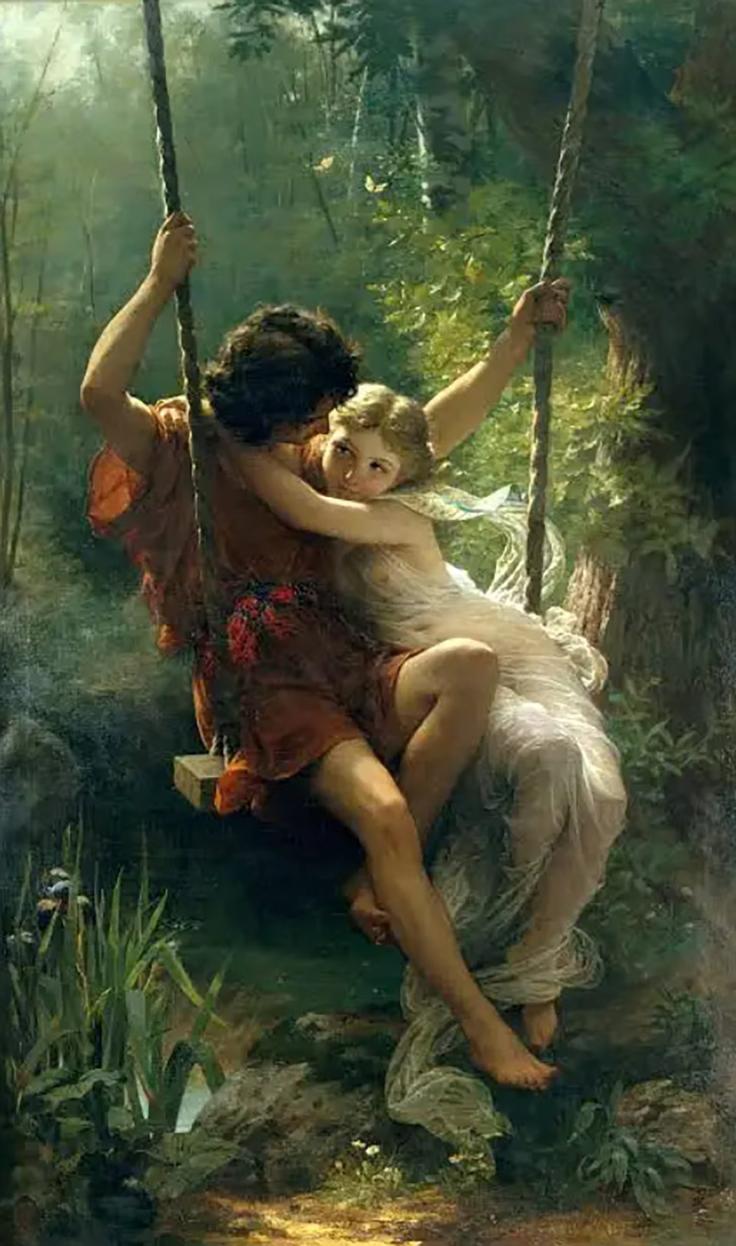 Una pareja de jóvenes se abraza sobre un columpio en la obra