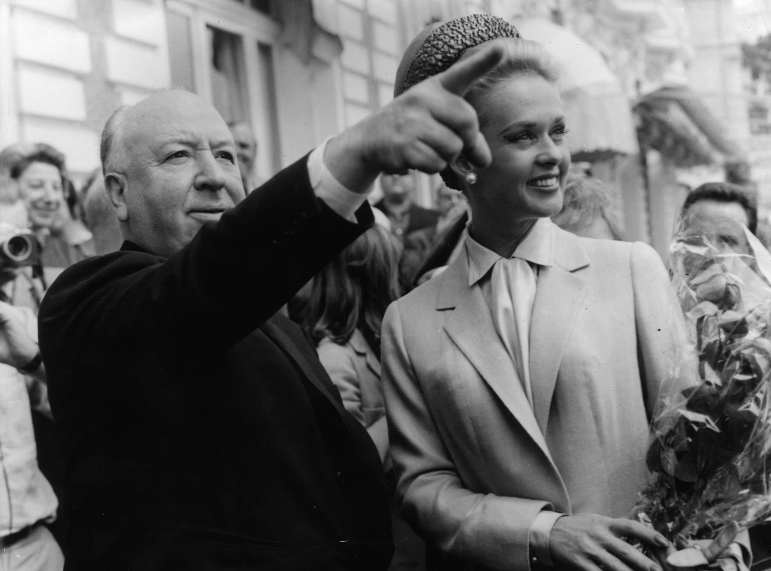9th May 1963: Alfred Hitchcock and American actress Tippi Hedren explore Cannes together after the premiere of his latest thriller 'The Birds' in which she plays the title role. (Photo by Keystone/Getty Images)