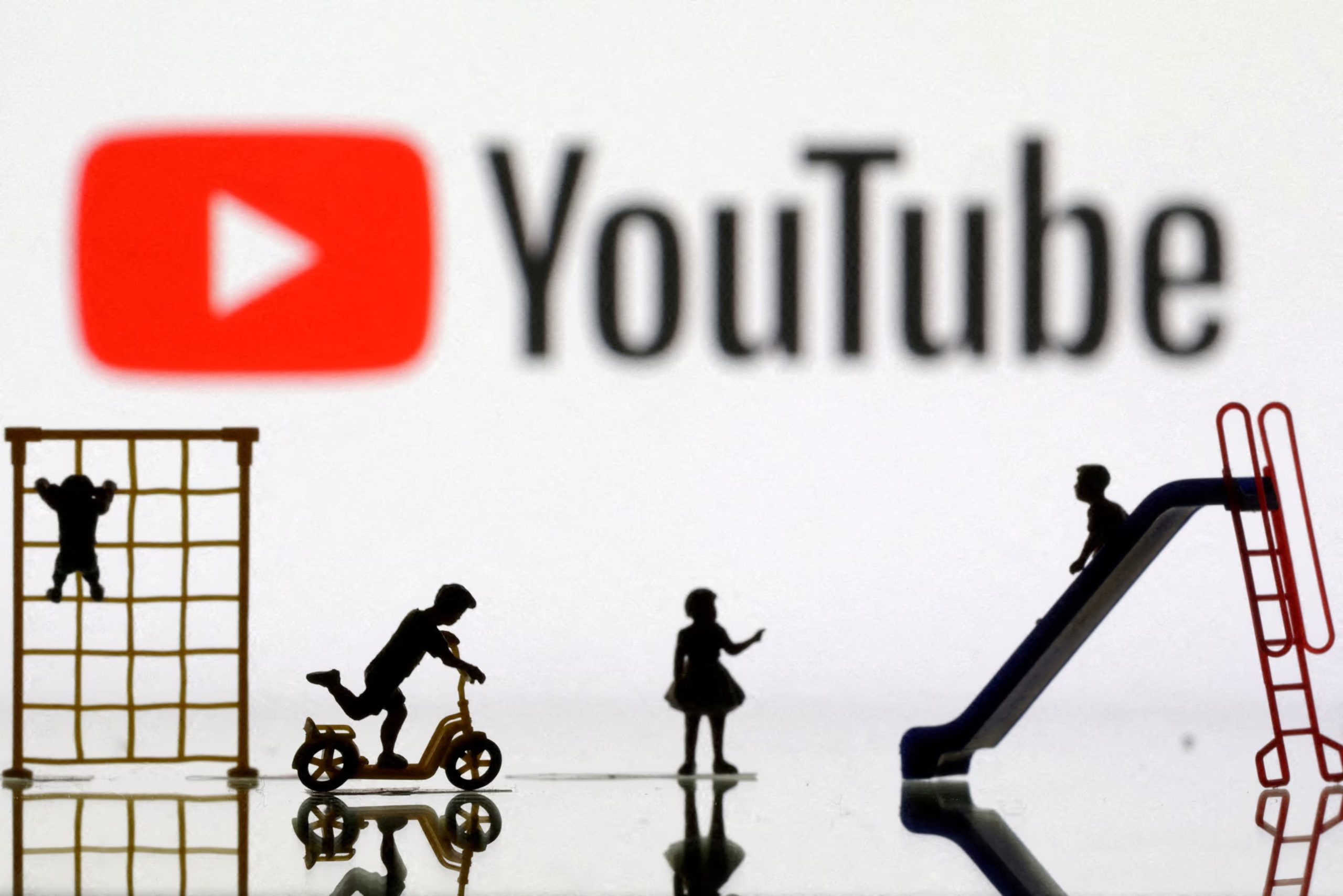 FILE PHOTO: Children playground miniatures are seen in front of displayed YouTube logo in this illustration taken April 4, 2023. REUTERS/Dado Ruvic/Illustration/File Photo
