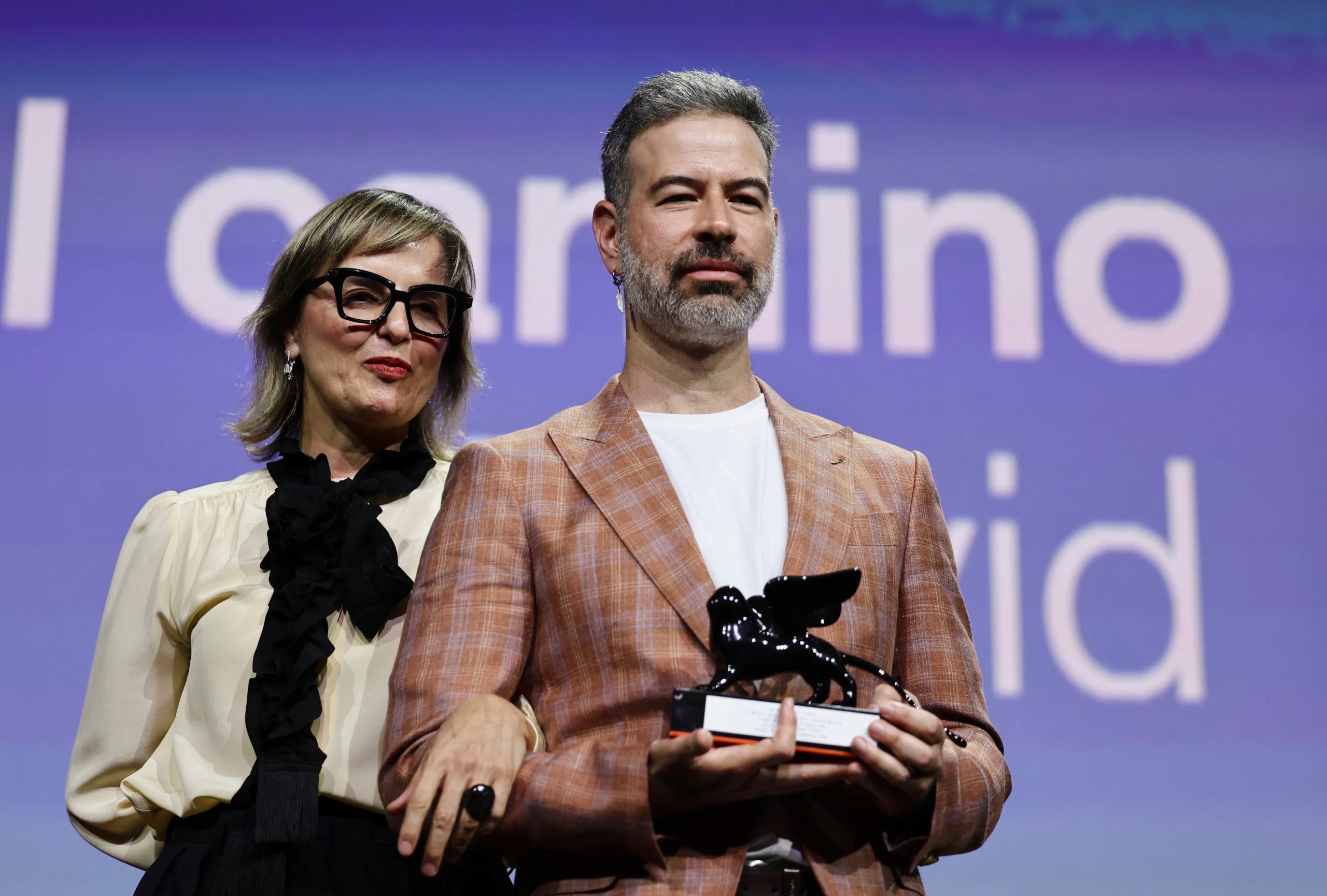 Director David Pablos and producer Inna Payan receive the Orizzonti Best Film Award for